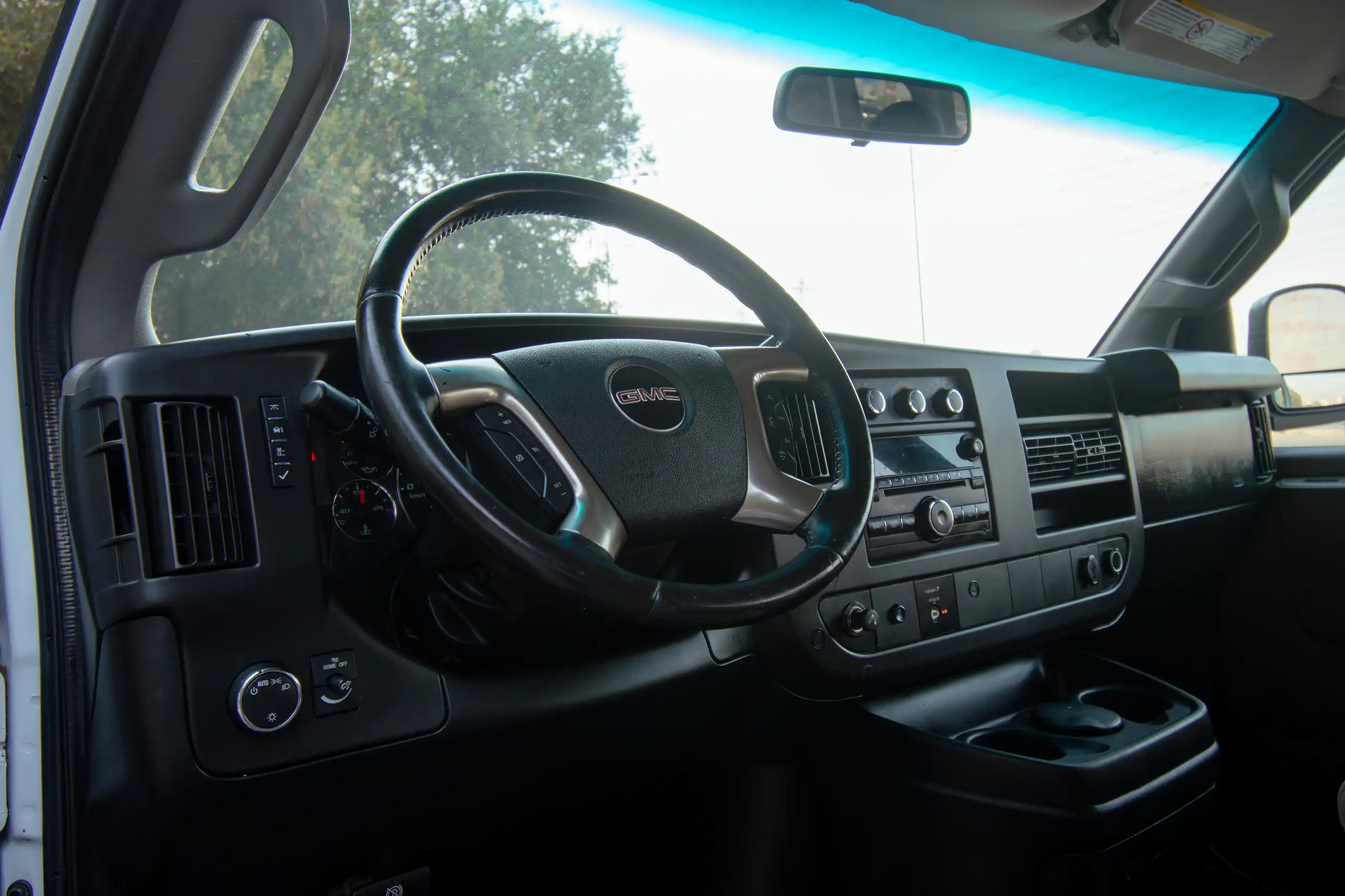 Used 2019 GMC Savana 3500 15-Seater Passenger White – Driver Side Dashboard & Steering View at First Choice Cars Sharjah