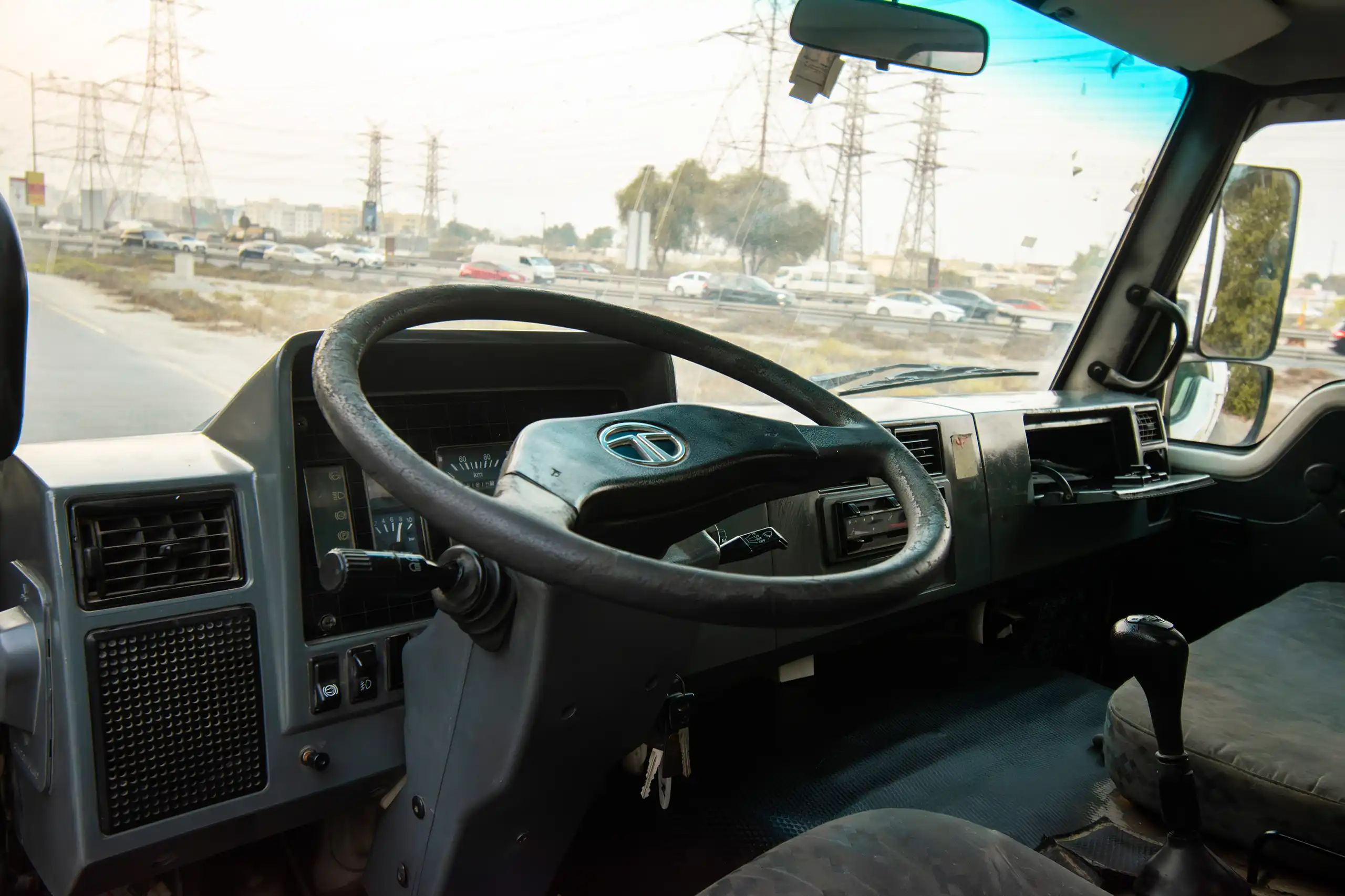 Used 2016 TATA LPT 613 Truck White – Driver Side Dashboard & Steering View at First Choice Cars Sharjah