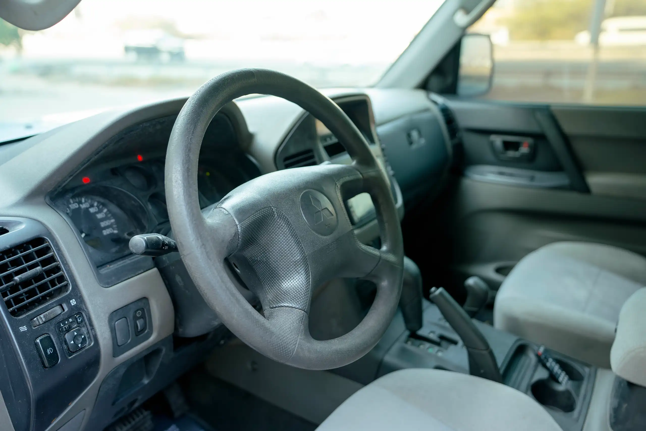 Used 2005 Mitsubishi PAJERO 3.0 GLS Silver – Driver Side Dashboard & Steering View at First Choice Cars Sharjah