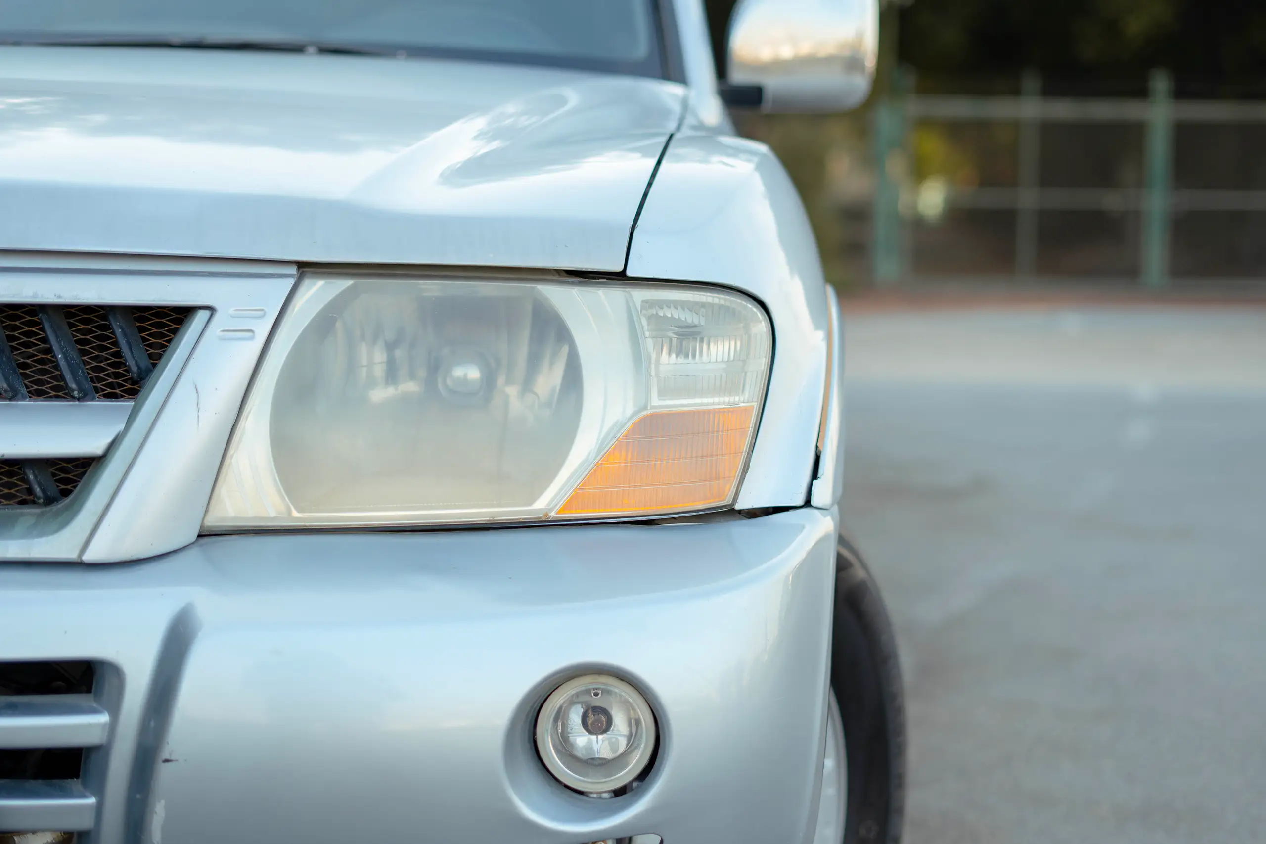 Used 2005 Mitsubishi Pajero GLS Silver – Headlight Close-up at First Choice Cars Sharjah
