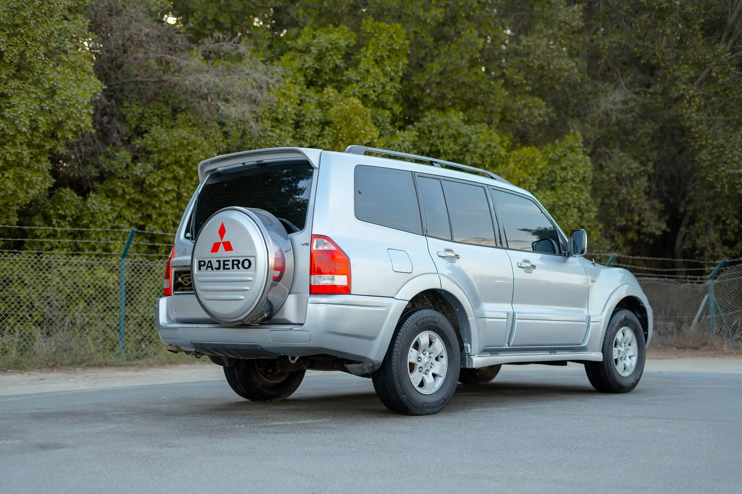 Used 2005 Mitsubishi Pajero GLS Silver – Rear Driver Side Cabin View at First Choice Cars Sharjah