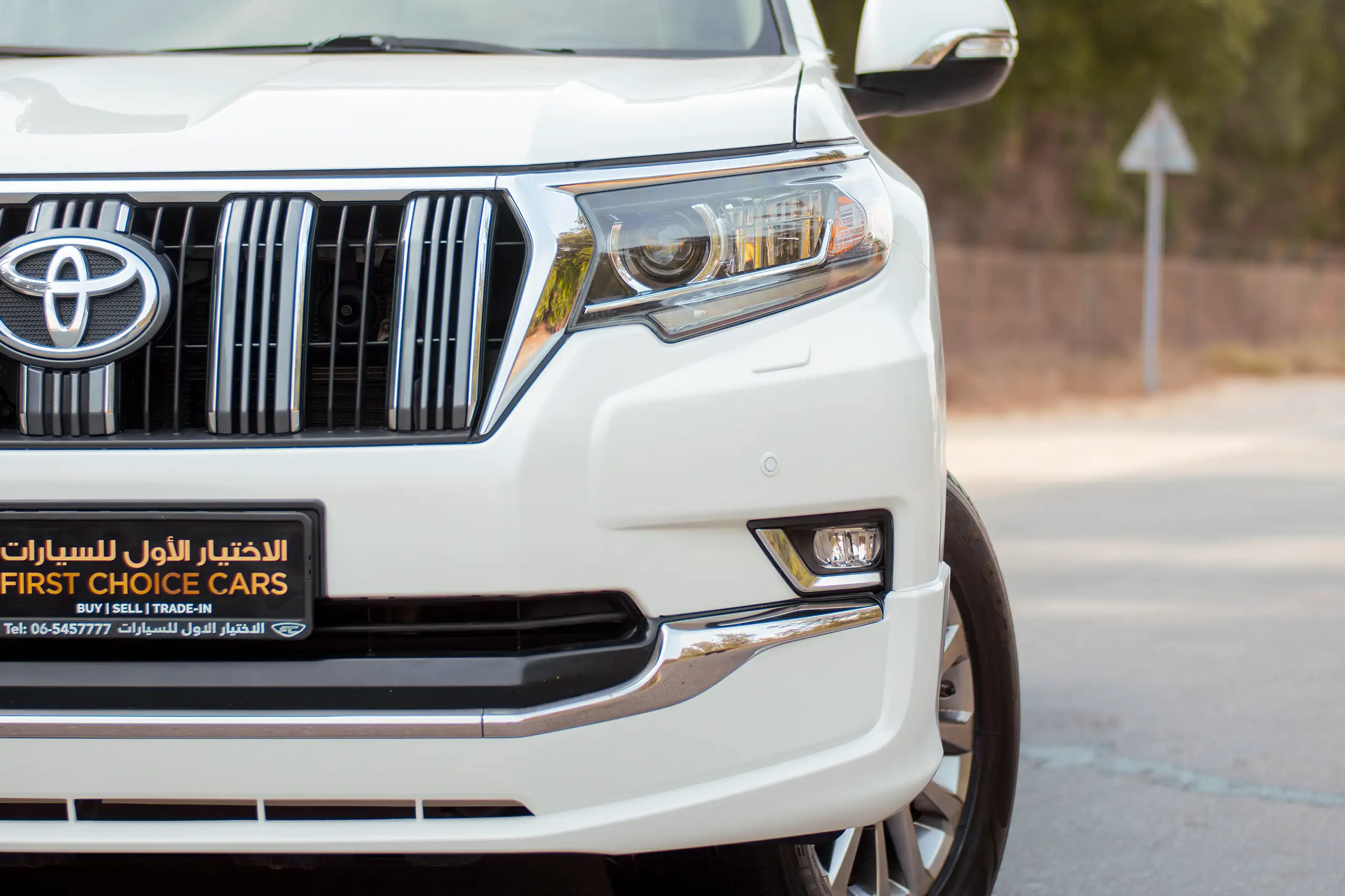 Used 2020 Toyota Prado VXR White – Headlight Close-up at First Choice Cars Sharjah
