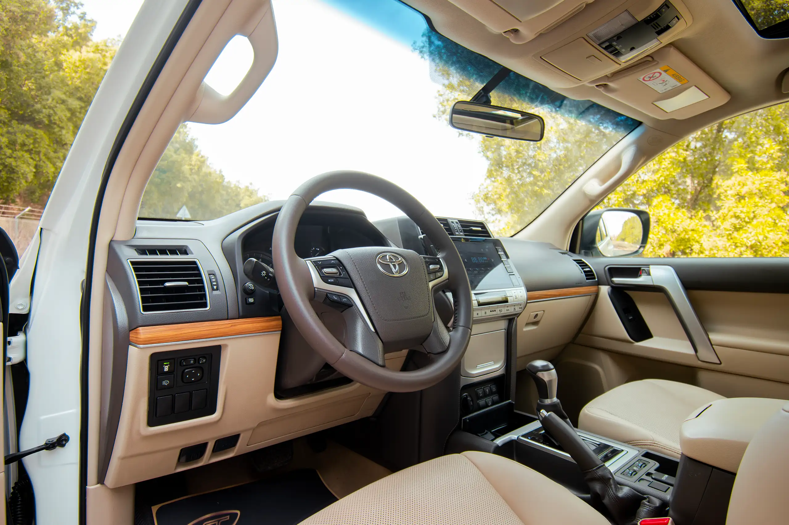 Used 2020 Toyota Prado VXR White – Driver Side Dashboard & Steering View at First Choice Cars Sharjah