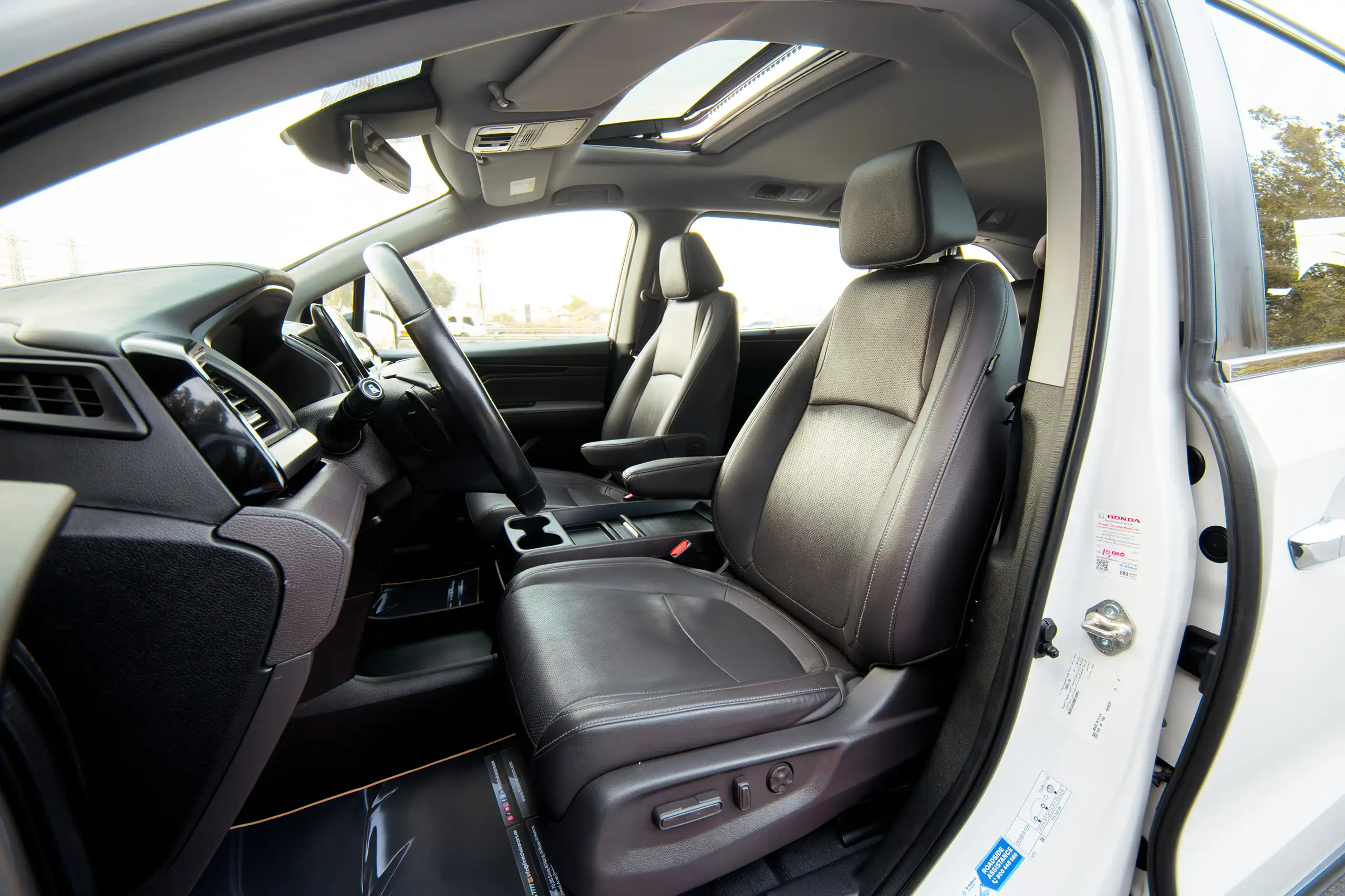 Used 2021 Honda Odyssey EX White – Front Driver Side Cabin View at First Choice Cars Sharjah