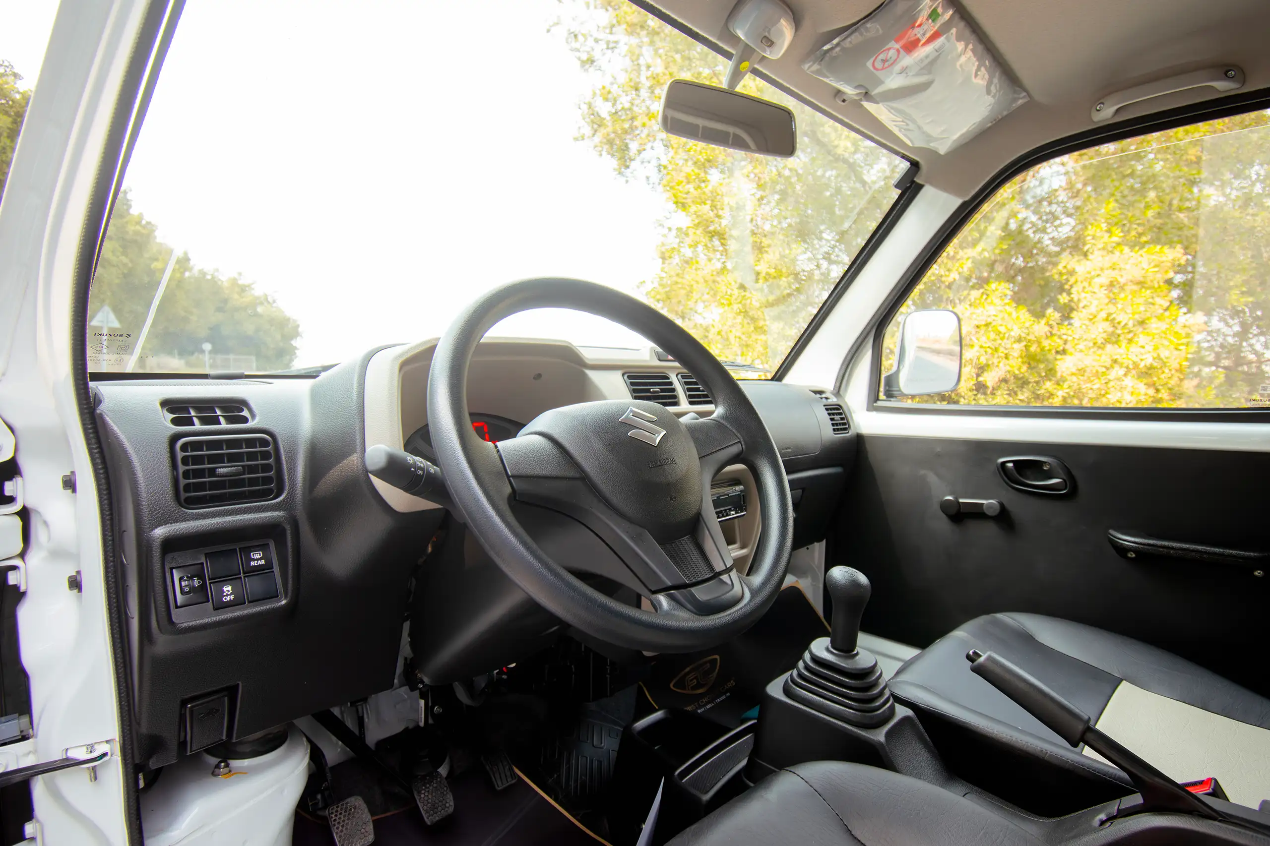 Used 2023 Suzuki Eeco Cargo White – Driver Side Dashboard & Steering View at First Choice Cars Sharjah