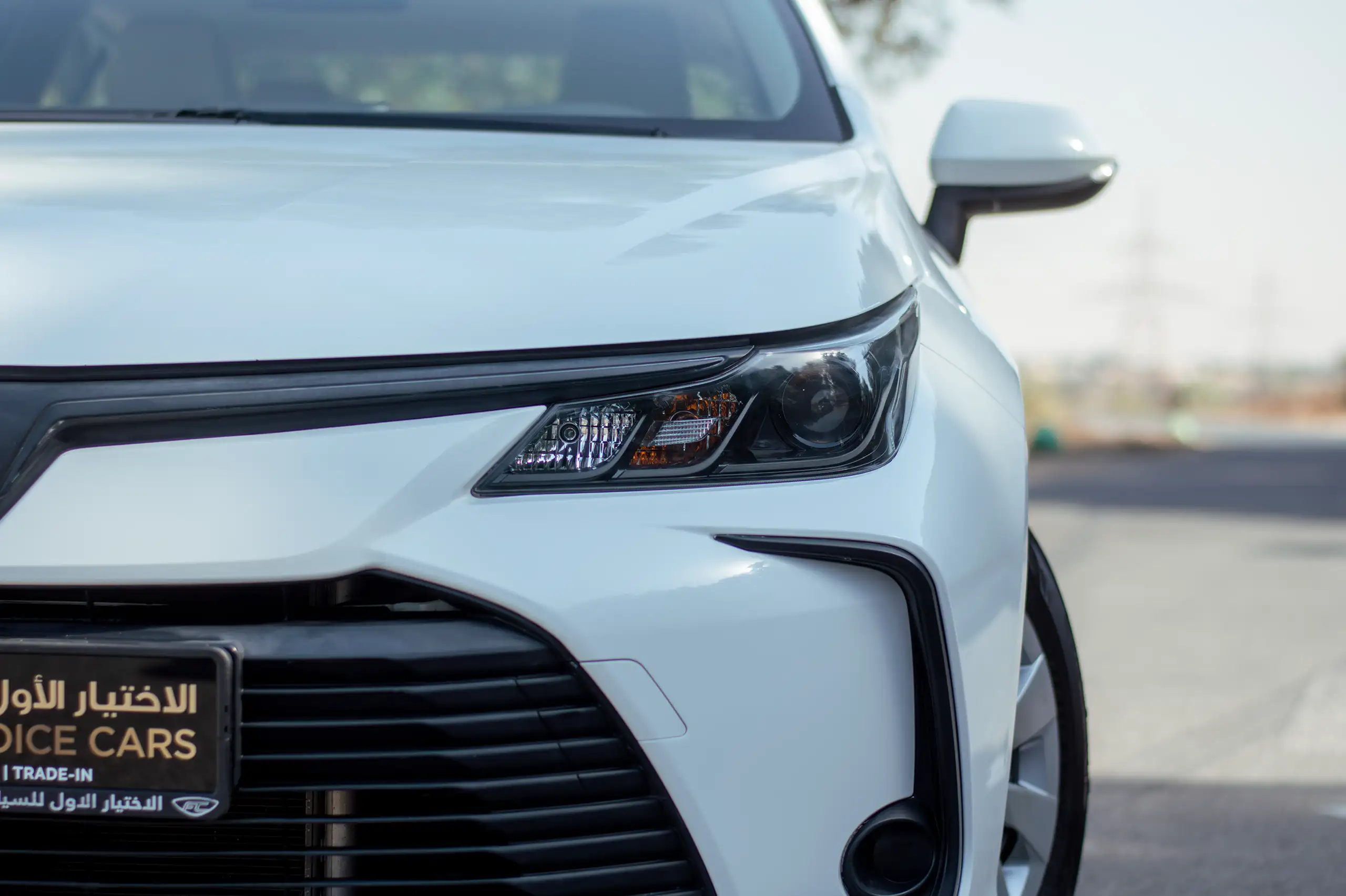 Used 2022 Toyota Corolla Xli White – Headlight Close-up at First Choice Cars Sharjah