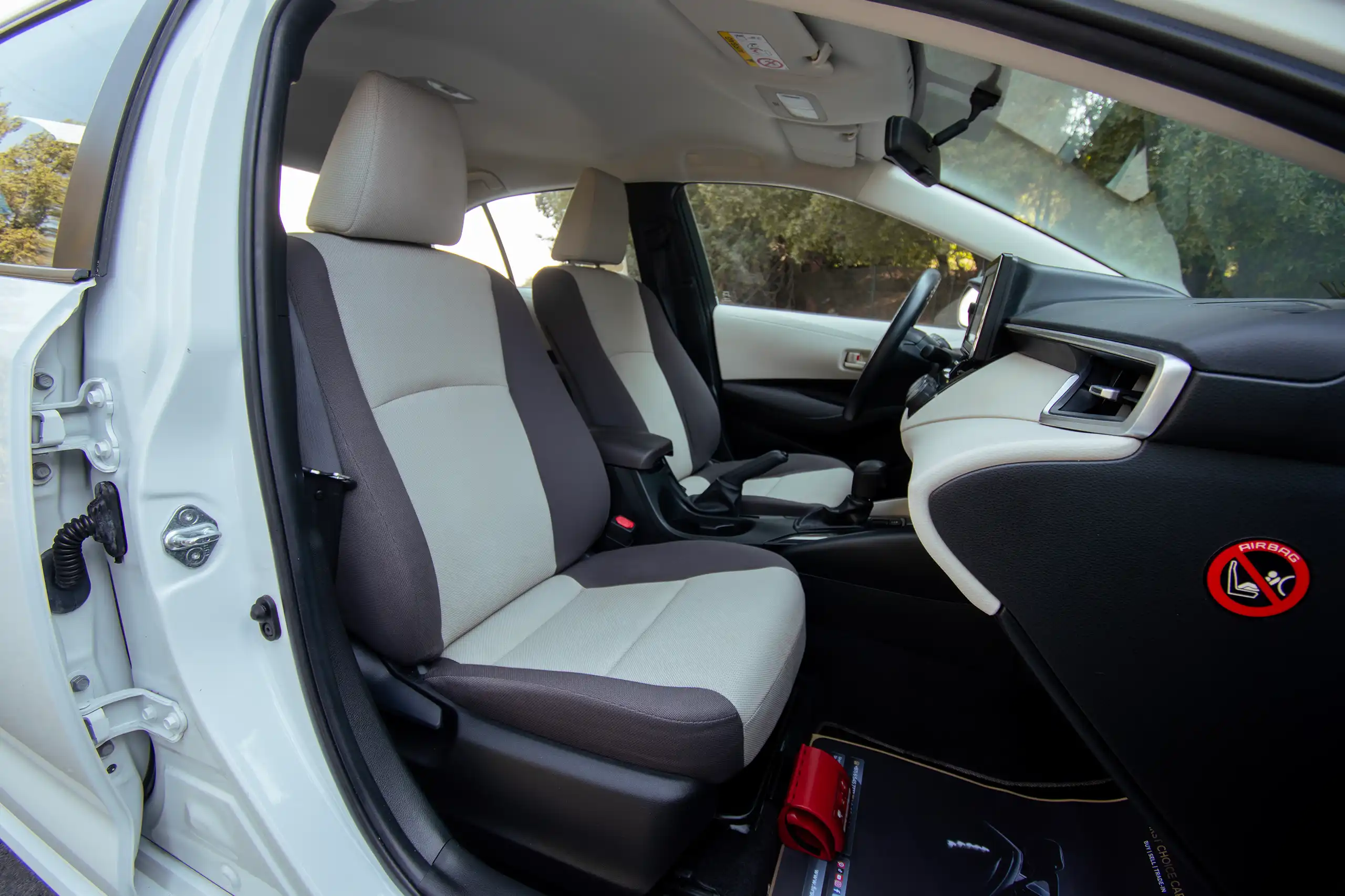 Used 2022 Toyota Corolla Xli White – Front Passenger Side Cabin View at First Choice Cars Sharjah