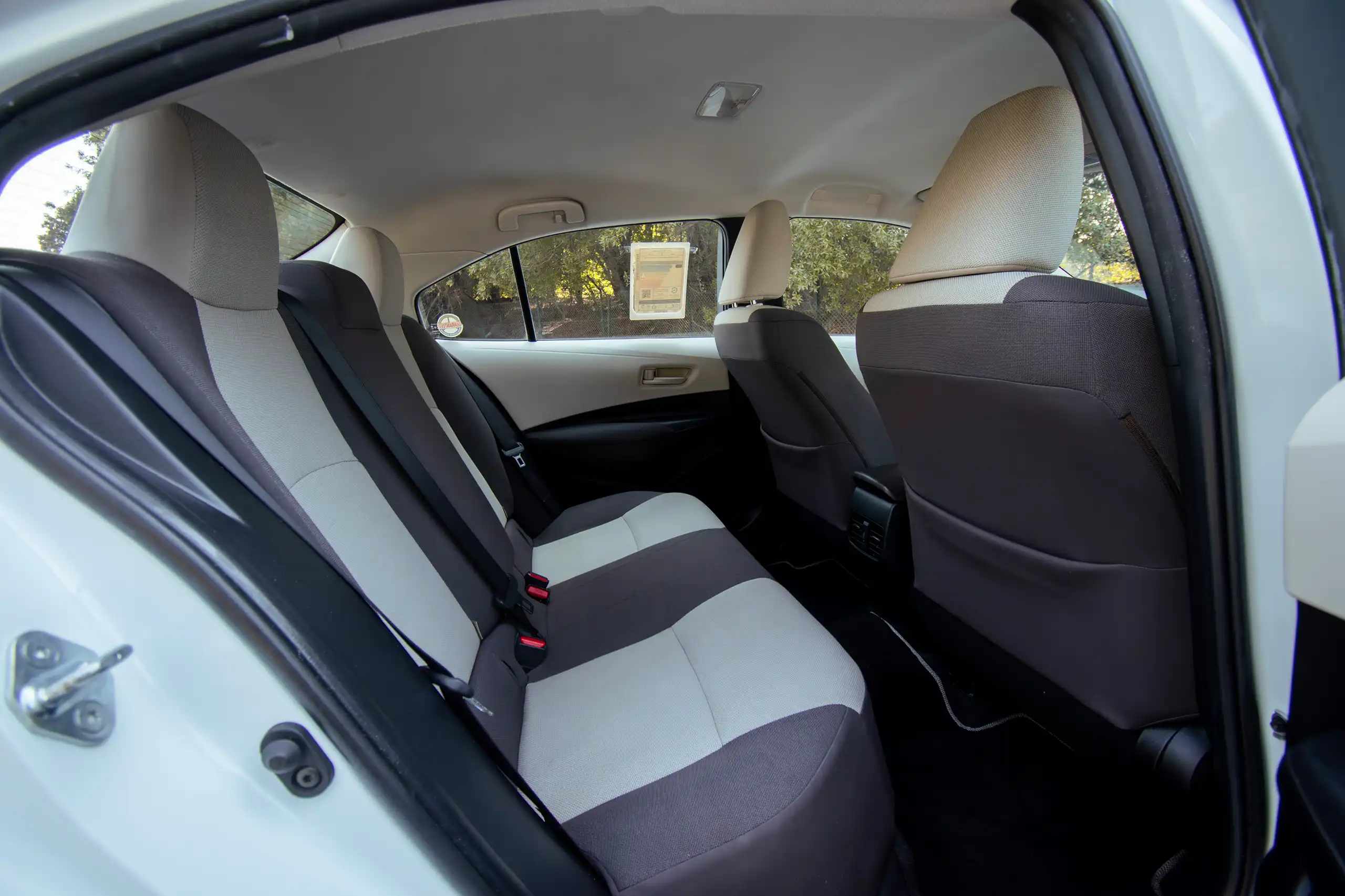 Used 2022 Toyota Corolla Xli White – Rear Passenger Side Cabin View at First Choice Cars Sharjah