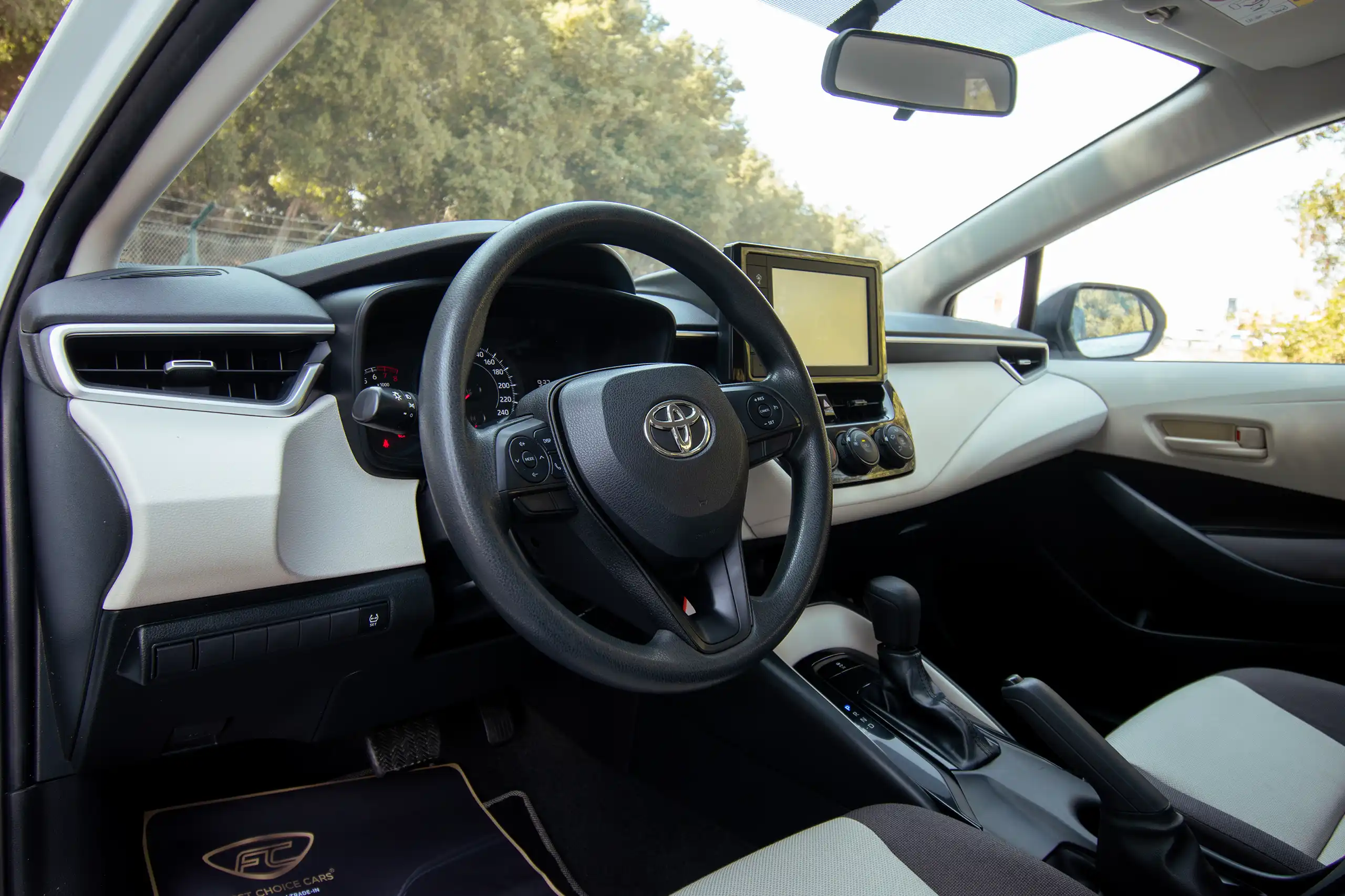 Used 2022 Toyota Corolla Xli White – Driver Side Dashboard & Steering View at First Choice Cars Sharjah