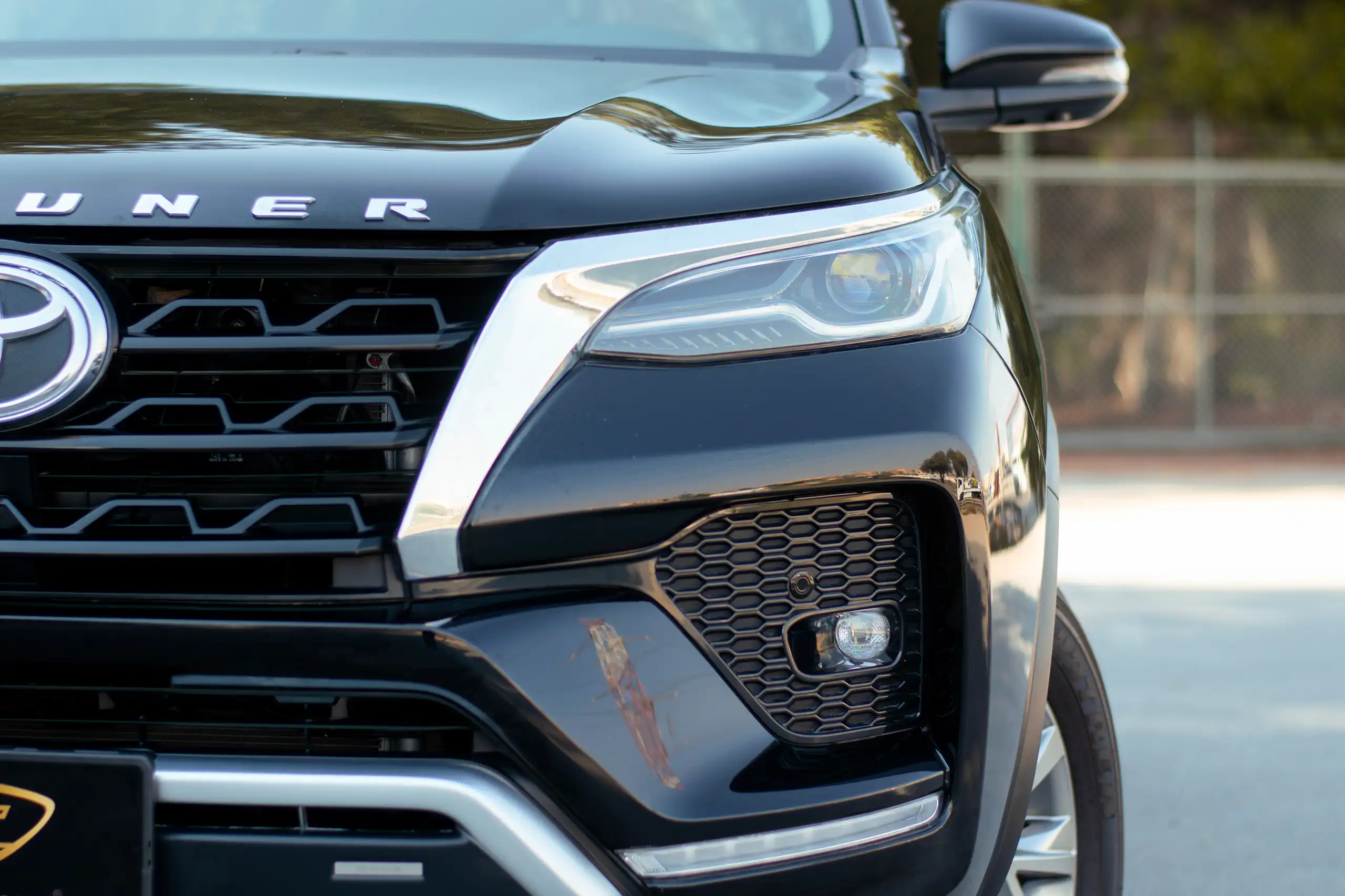 Used 2024 Toyota Fortuner VXR Black – Headlight Close-up at First Choice Cars Sharjah