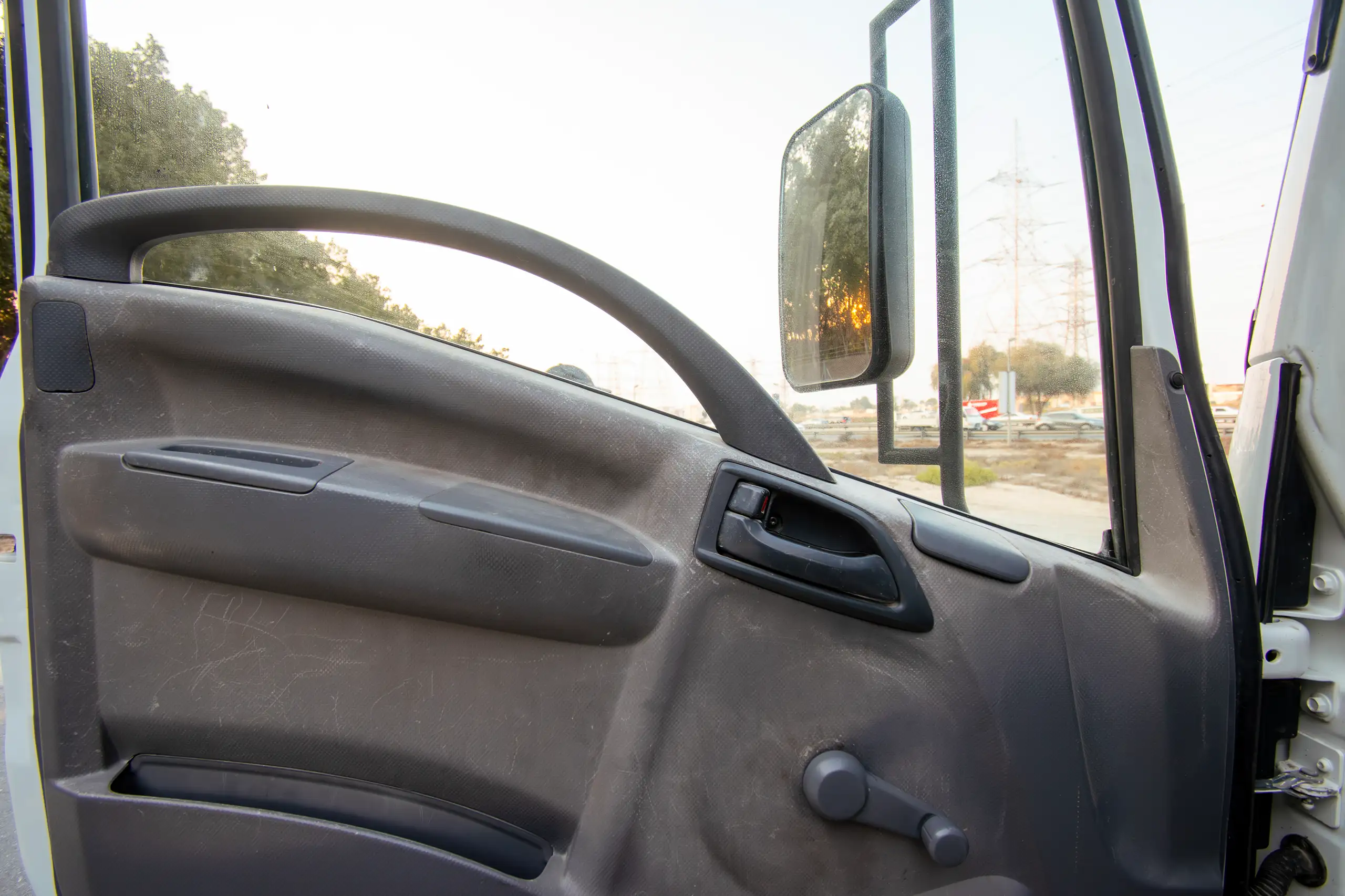 Used 2016 Isuzu N-Series Npr White – Driver Door Panel Full View at First Choice Cars Sharjah