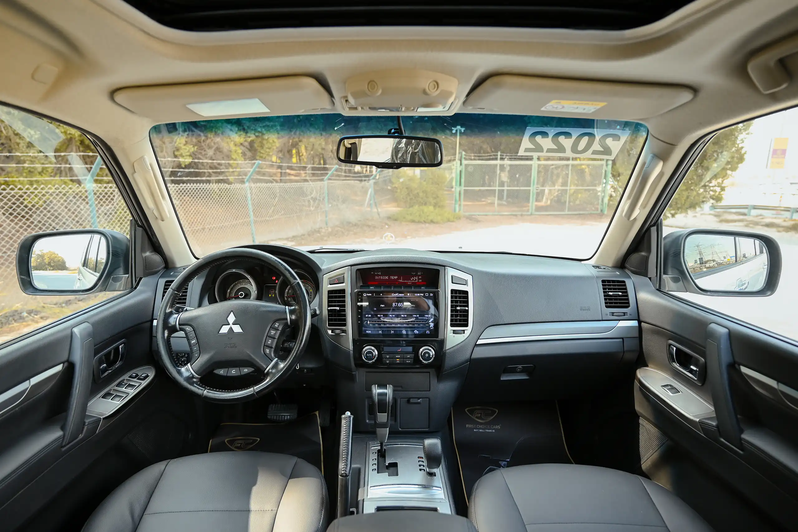 Used 2022 Mitsubishi PAJERO GLS White – Front Cabin / Dashboard Full View at First Choice Cars Sharjah