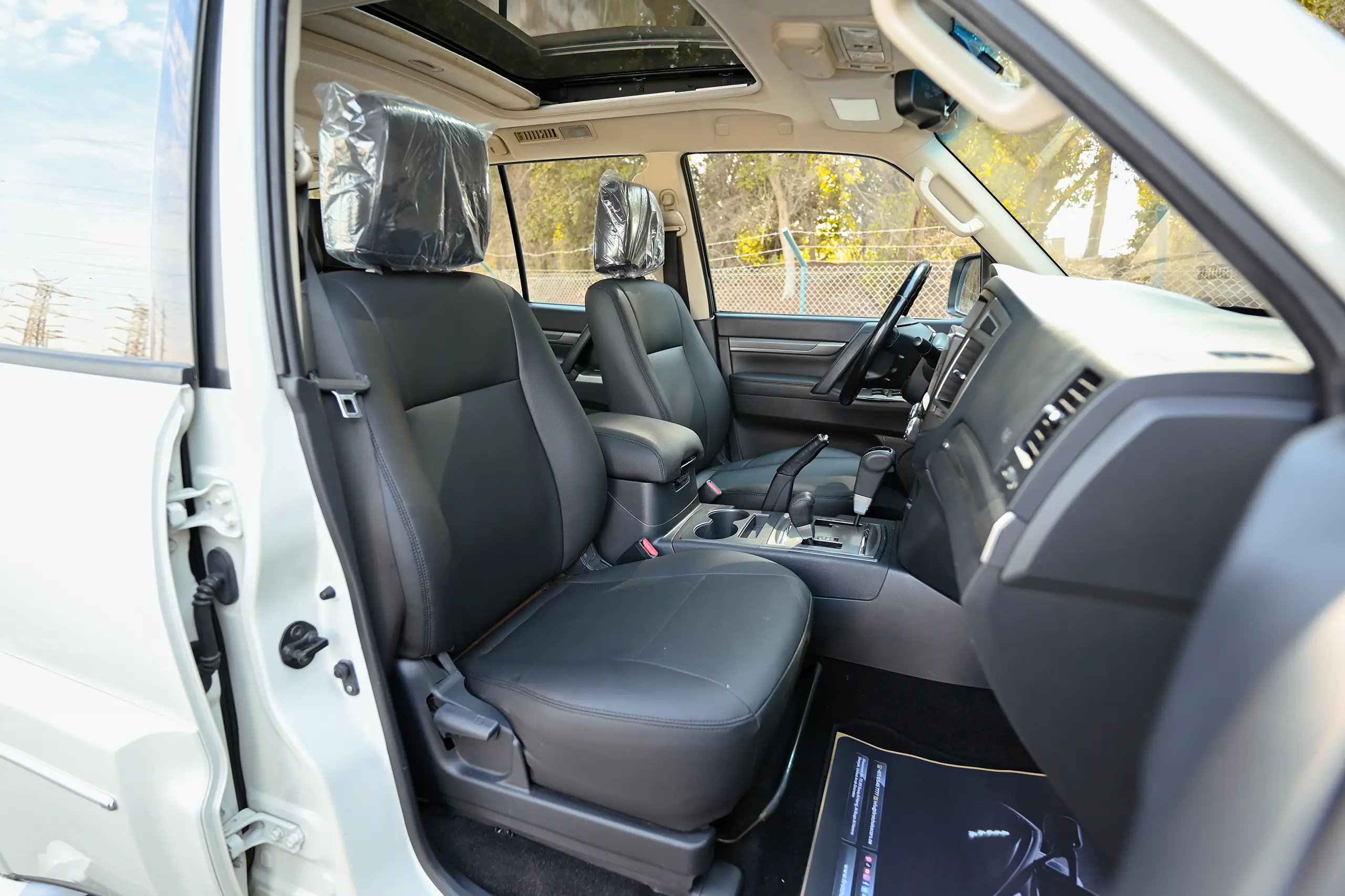 Used 2022 Mitsubishi PAJERO GLS White – Front Passenger Side Cabin View at First Choice Cars Sharjah