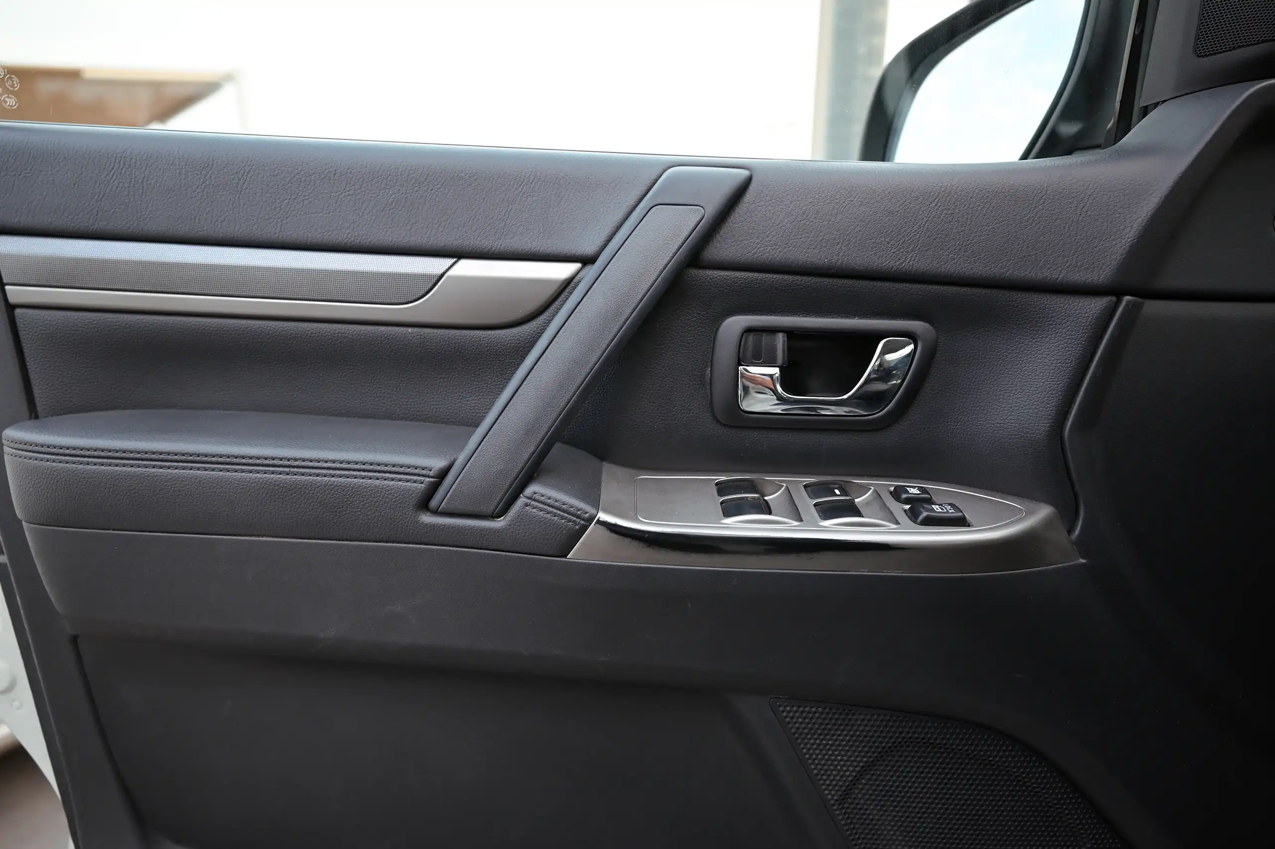 Used 2022 Mitsubishi PAJERO GLS White – Driver Door Panel Full View at First Choice Cars Sharjah