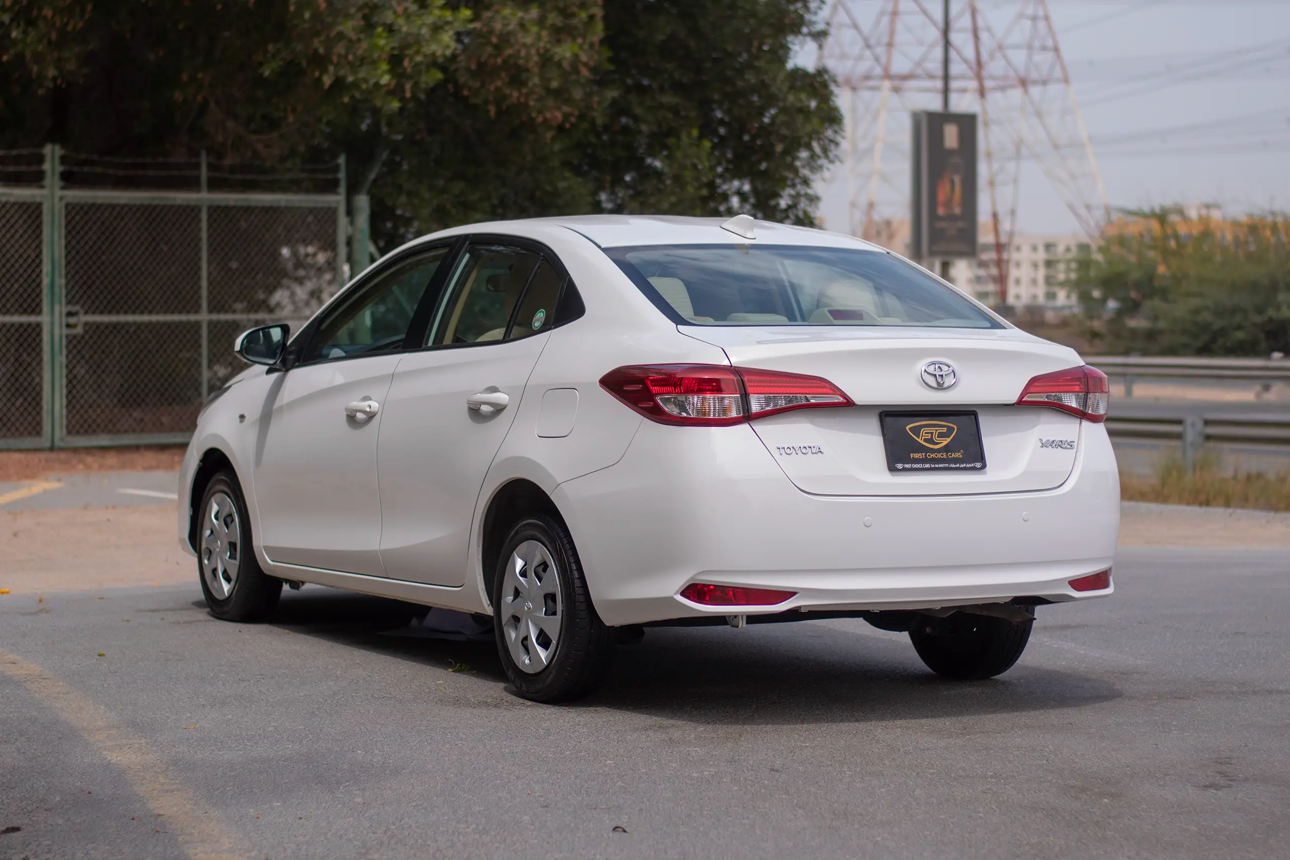Used 2022 Toyota Yaris E White – Left Back Diagonal (45°) View at First Choice Cars Sharjah