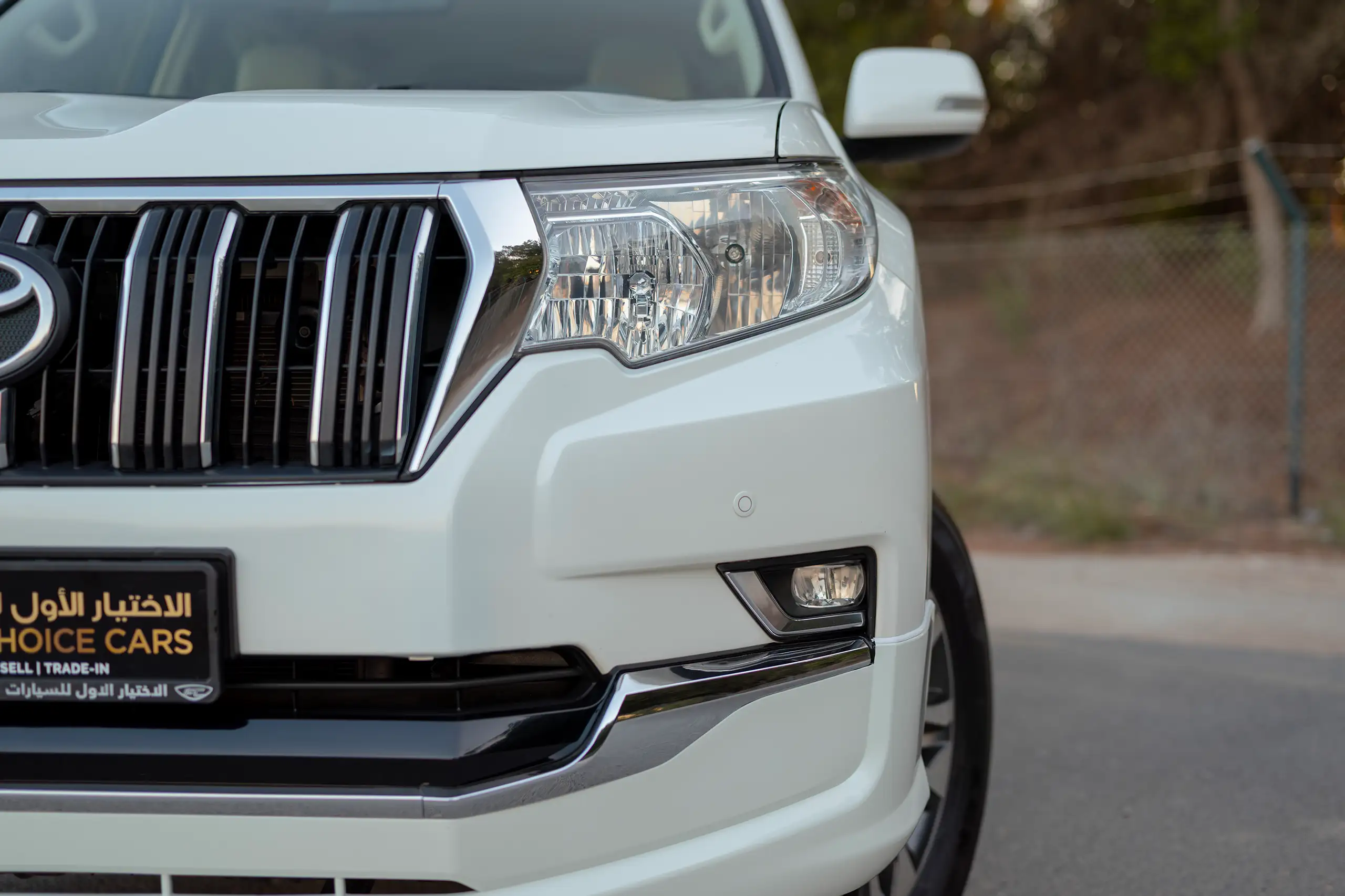 Used 2022 Toyota Prado Gxr White – Headlight Close-up at First Choice Cars Sharjah