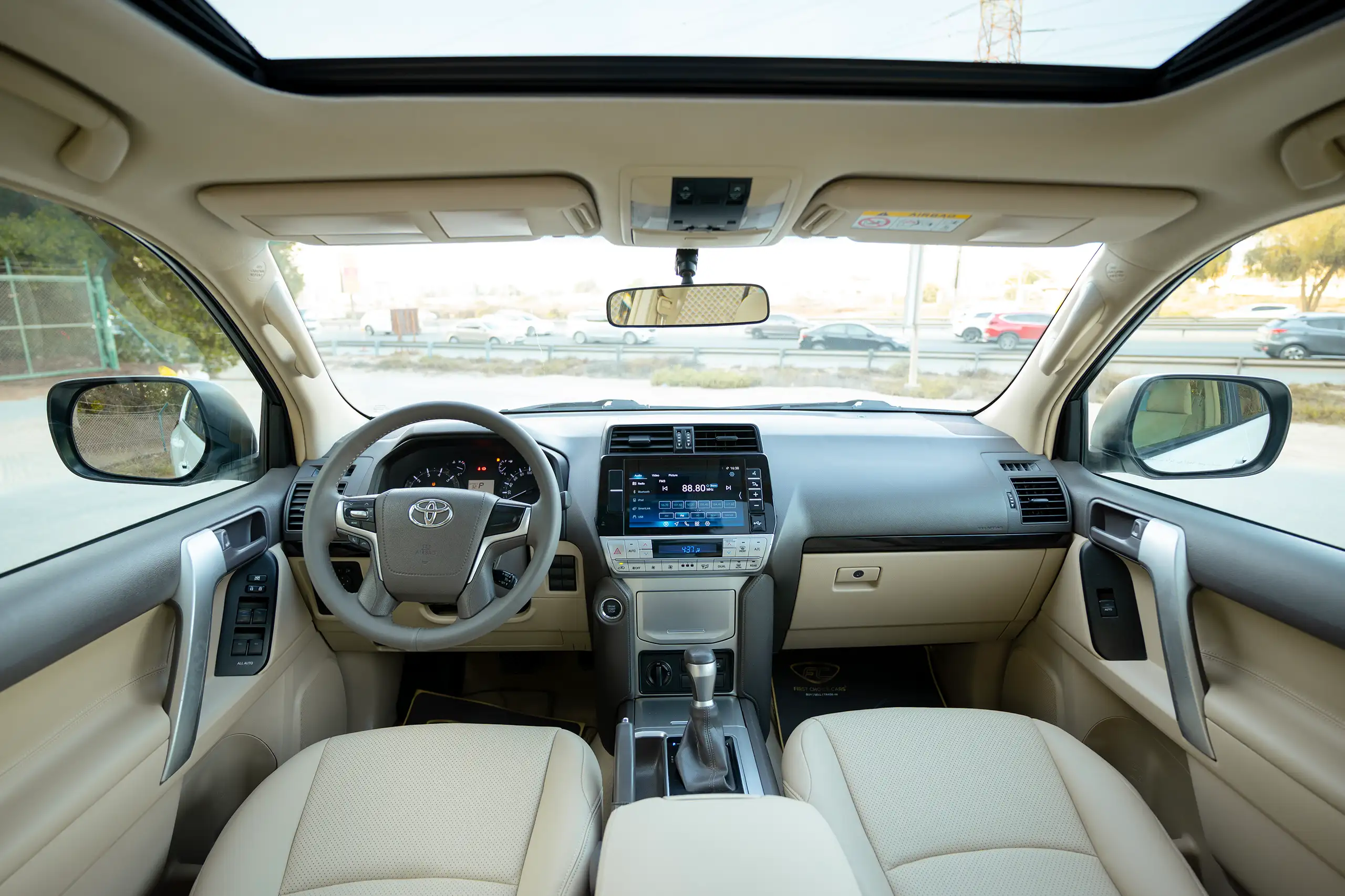 Used 2022 Toyota Prado Gxr White – Front Cabin / Dashboard Full View at First Choice Cars Sharjah