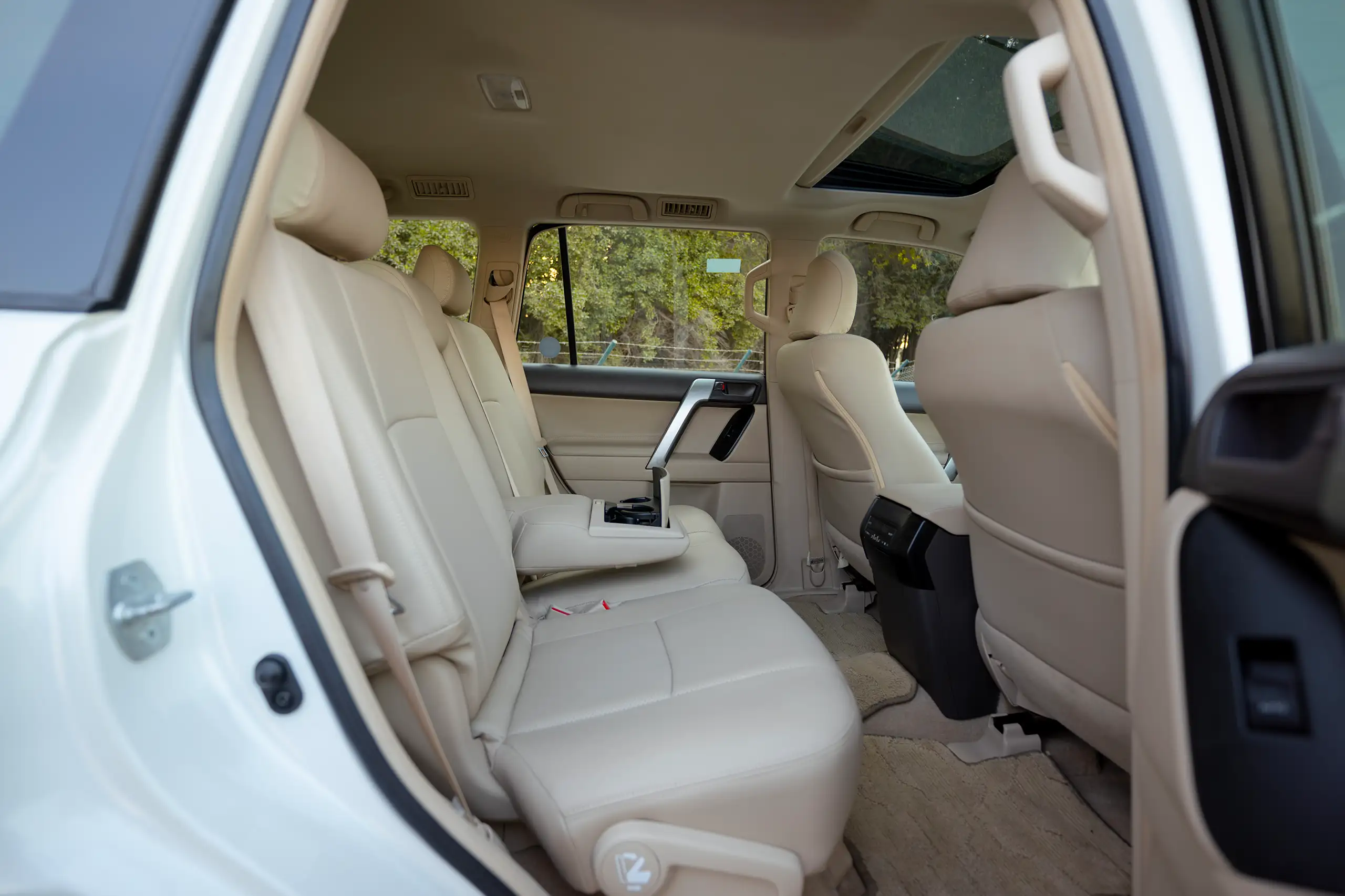 Used 2022 Toyota Prado Gxr White – Rear Passenger Side Cabin View at First Choice Cars Sharjah