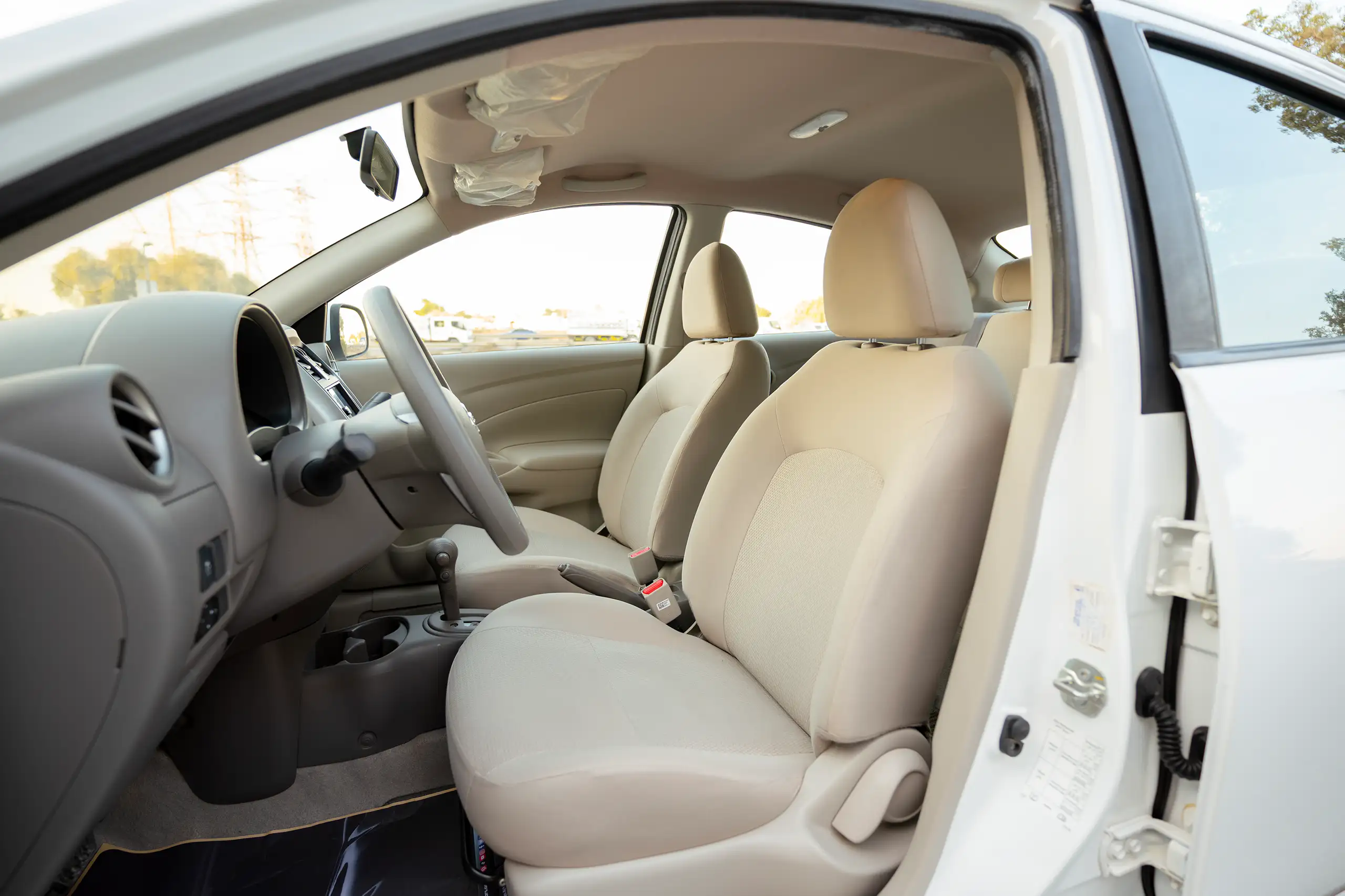 Used 2024 Nissan Sunny SV White – Front Driver Side Cabin View at First Choice Cars Sharjah