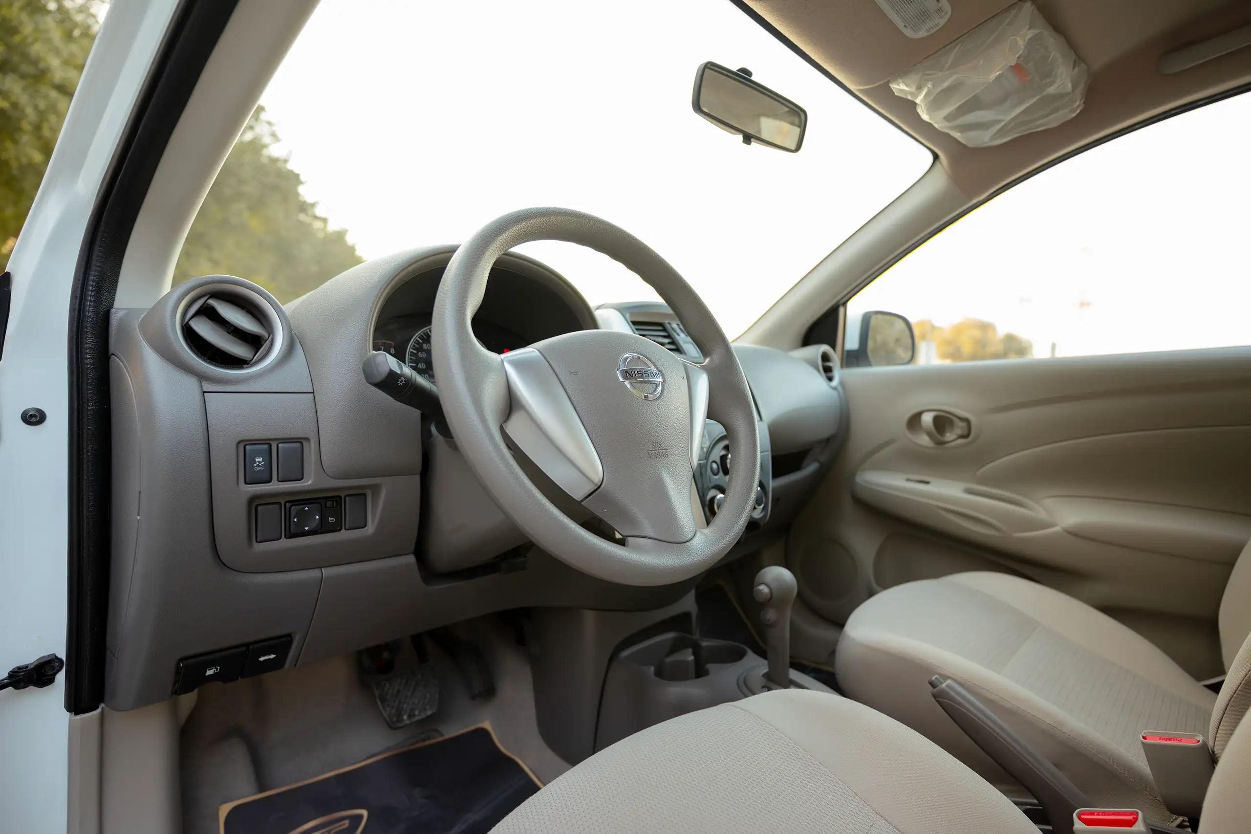 Used 2024 Nissan Sunny SV White – Driver Side Dashboard & Steering View at First Choice Cars Sharjah
