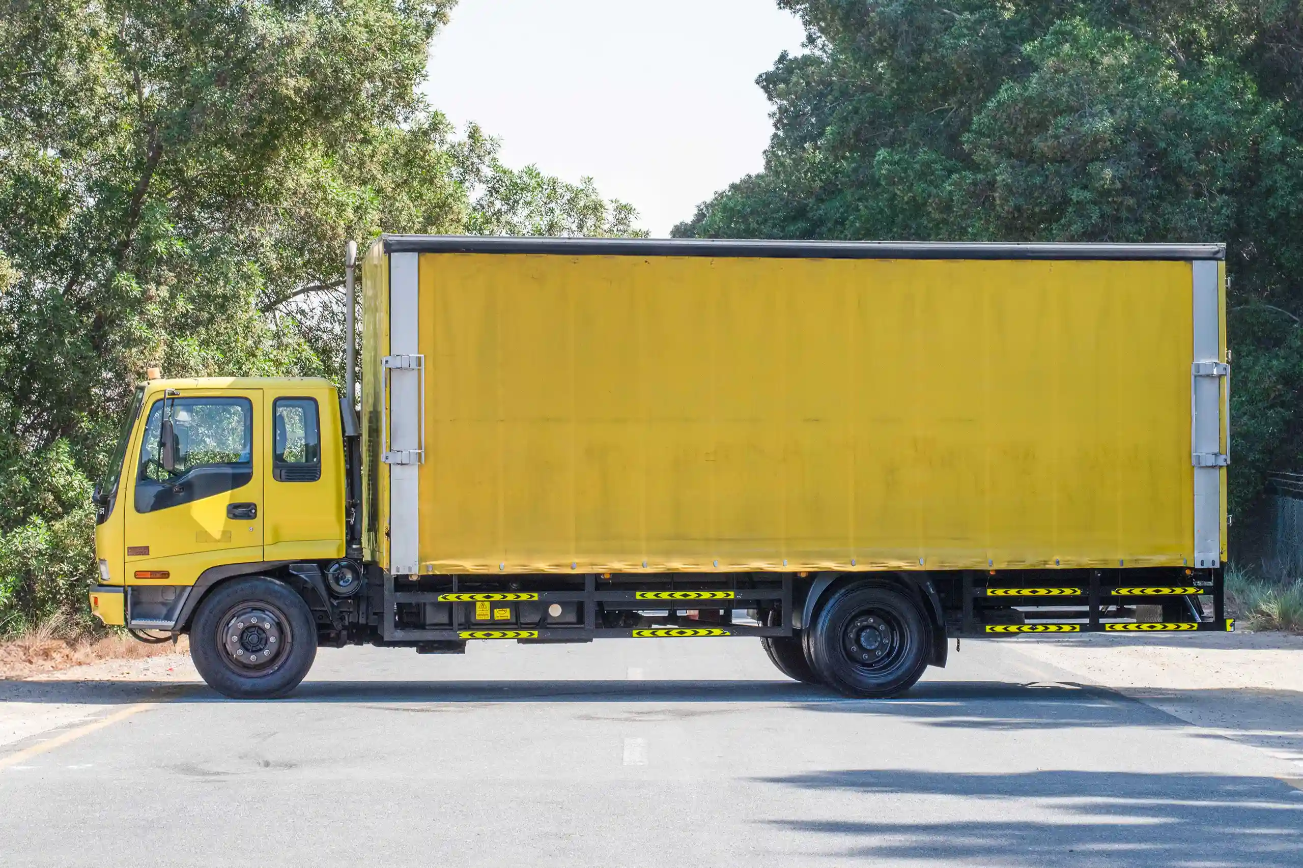 Used 2016 Isuzu FSR Cargo Truck Yellow – Left Back Diagonal (45°) View at First Choice Cars Sharjah
