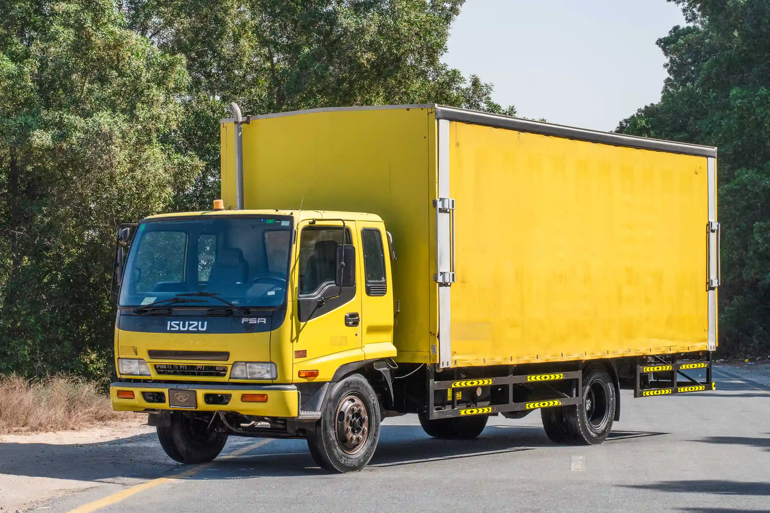 Used 2016 Isuzu FSR Cargo Truck Yellow – Left Front Diagonal (45°) View at First Choice Cars Sharjah