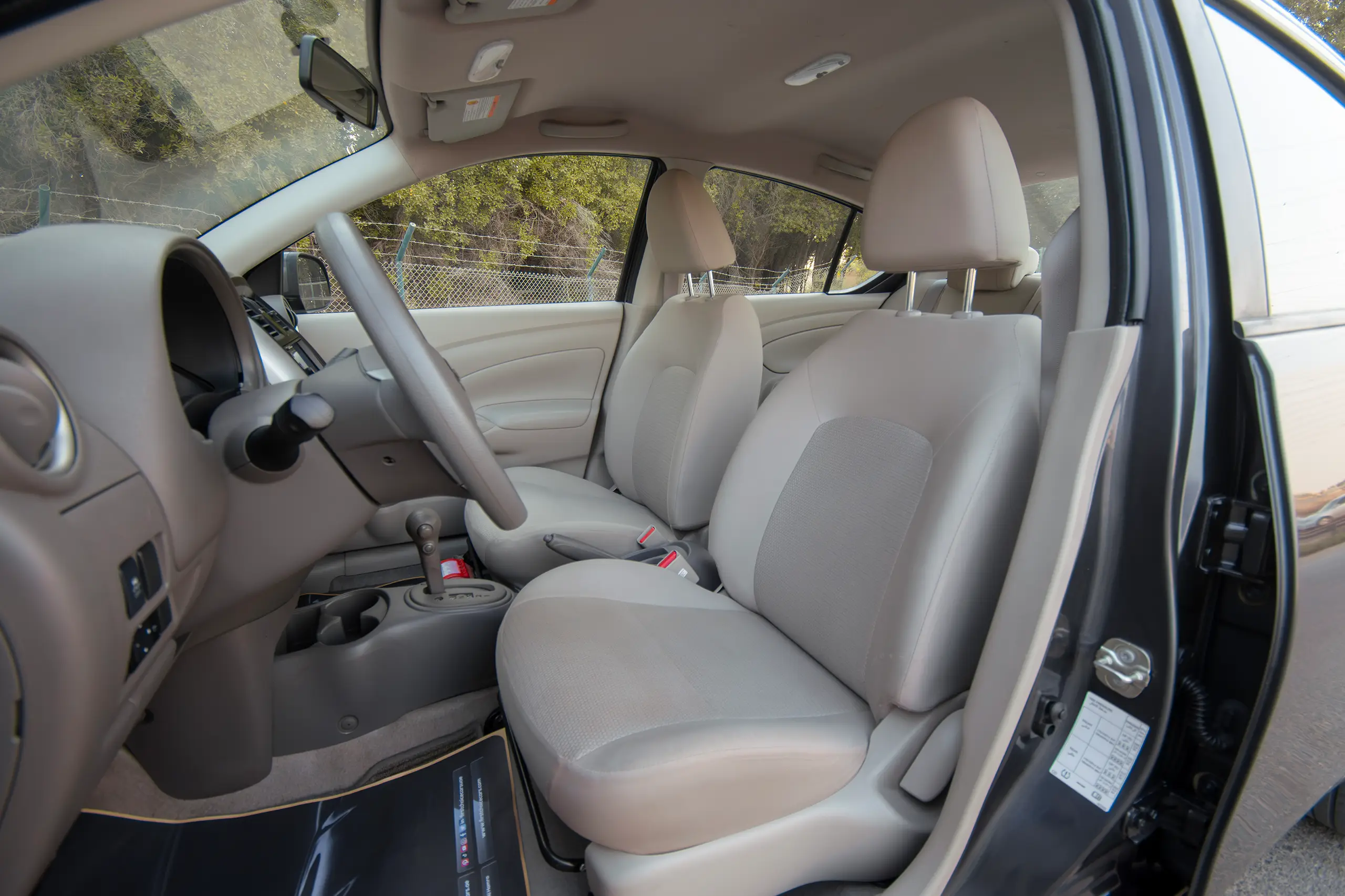 Used 2023 Nissan Sunny SV Grey – Front Driver Side Cabin View at First Choice Cars Sharjah