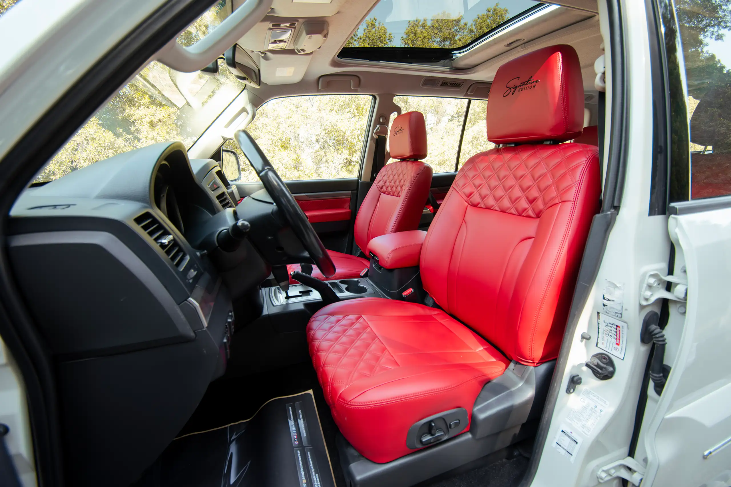 Used 2022 Mitsubishi Pajero GLS White – Front Driver Side Cabin View at First Choice Cars Sharjah