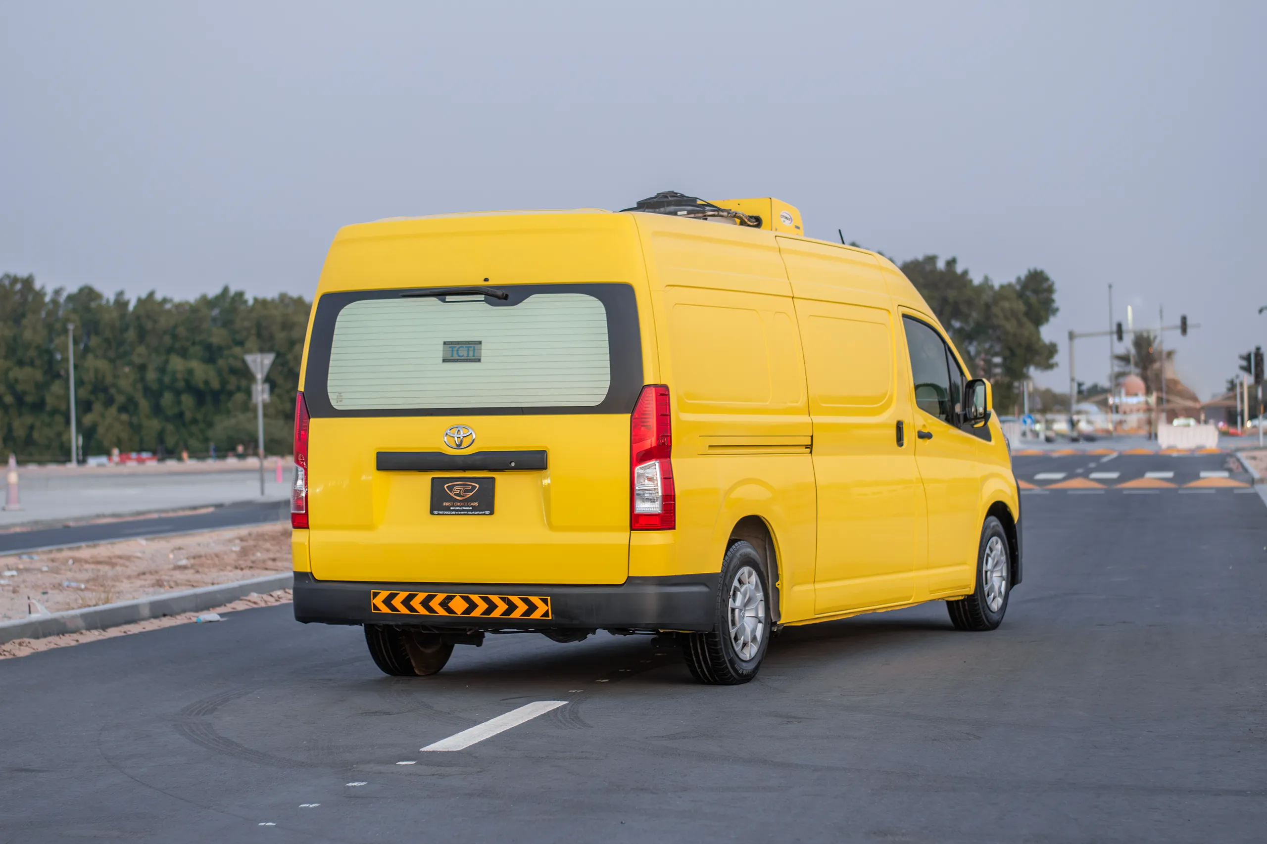 Used 2020 Toyota Hiace GL- High Roof Yellow – Right Back Diagonal (45°) View at First Choice Cars Sharjah
