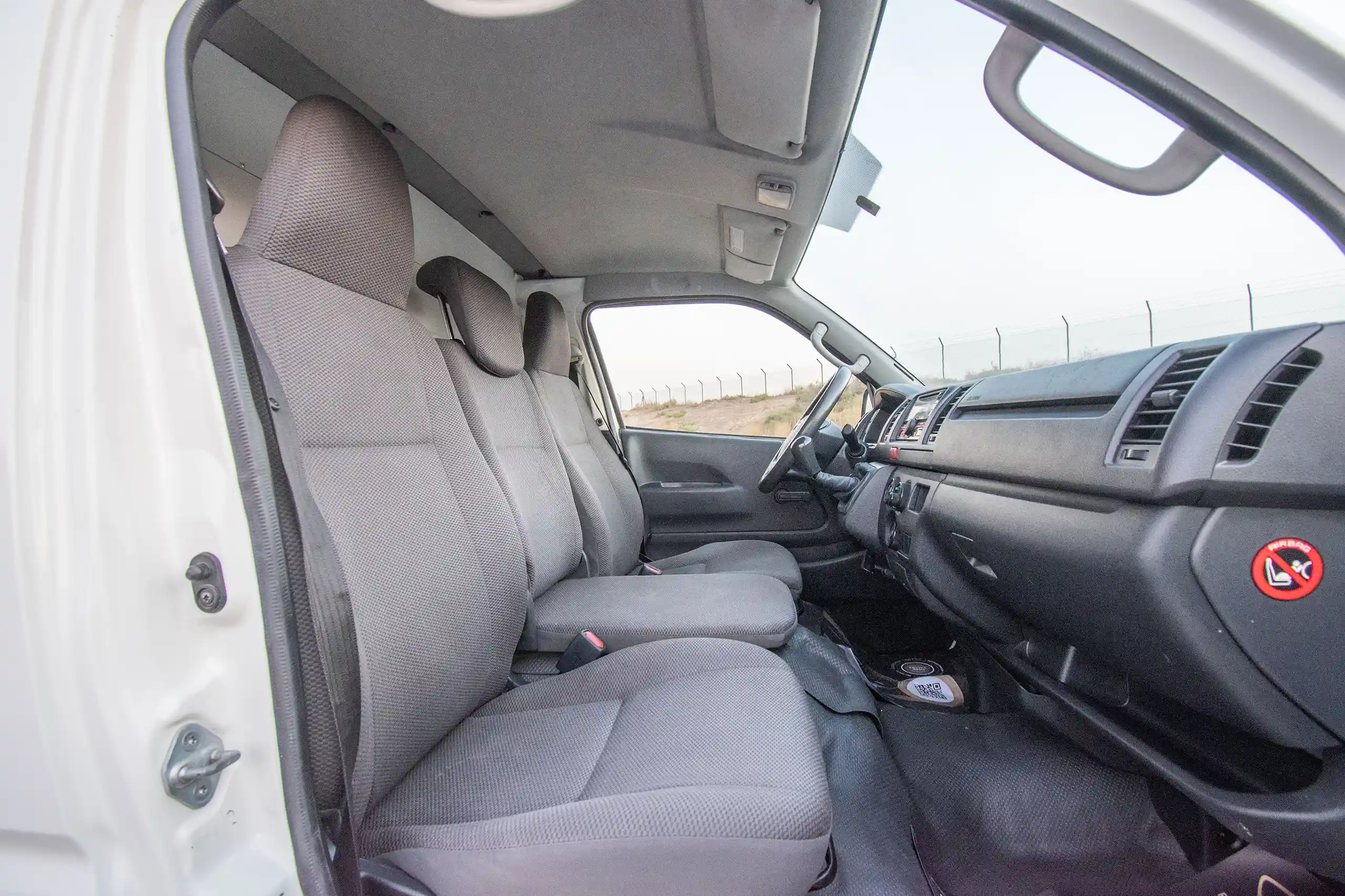 Used 2022 Toyota Hiace GL - Std Roof White – Front Passenger Side Cabin View at First Choice Cars Sharjah
