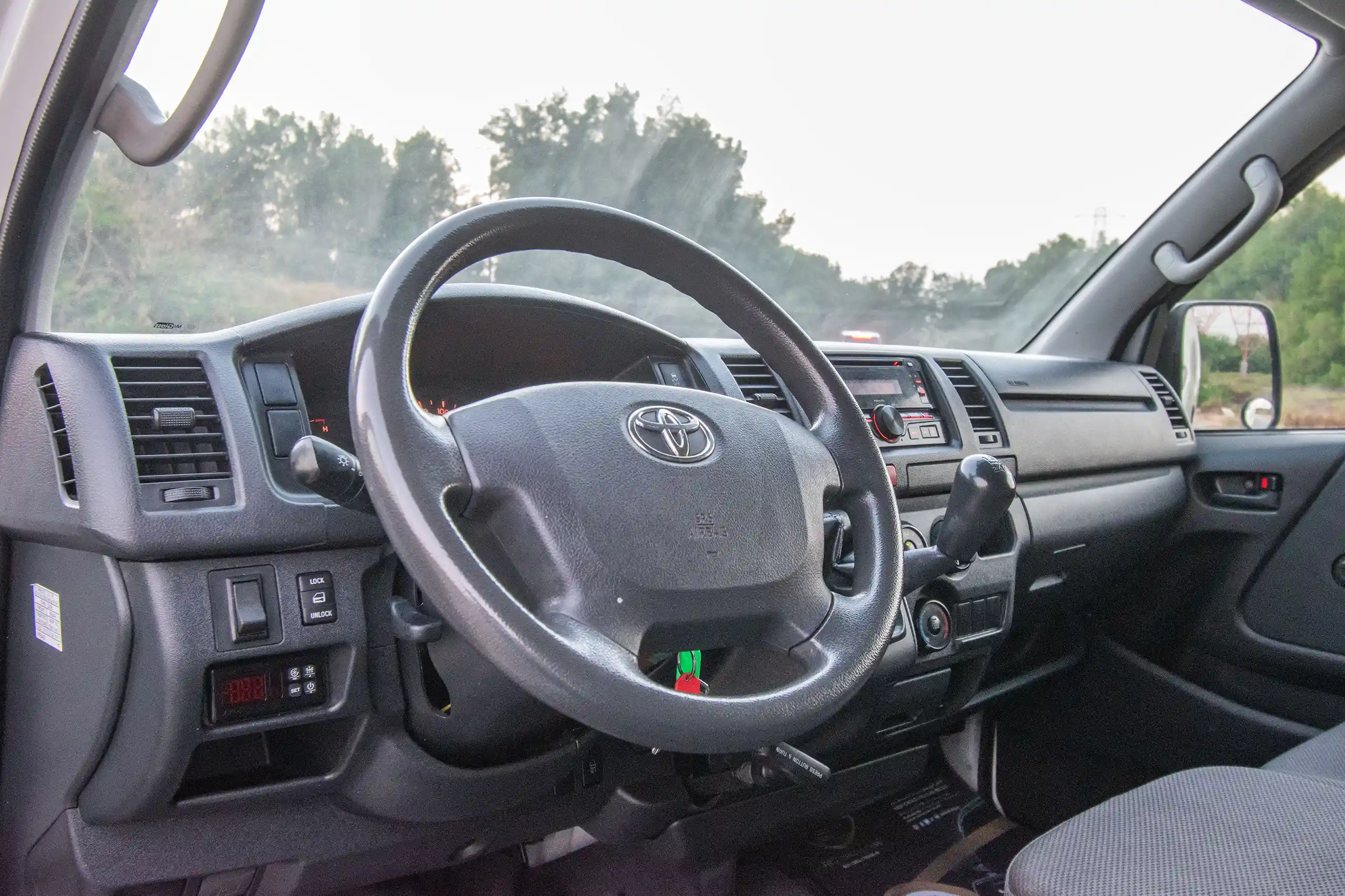 Used 2022 Toyota Hiace GL - Std Roof White – Driver Side Dashboard & Steering View at First Choice Cars Sharjah