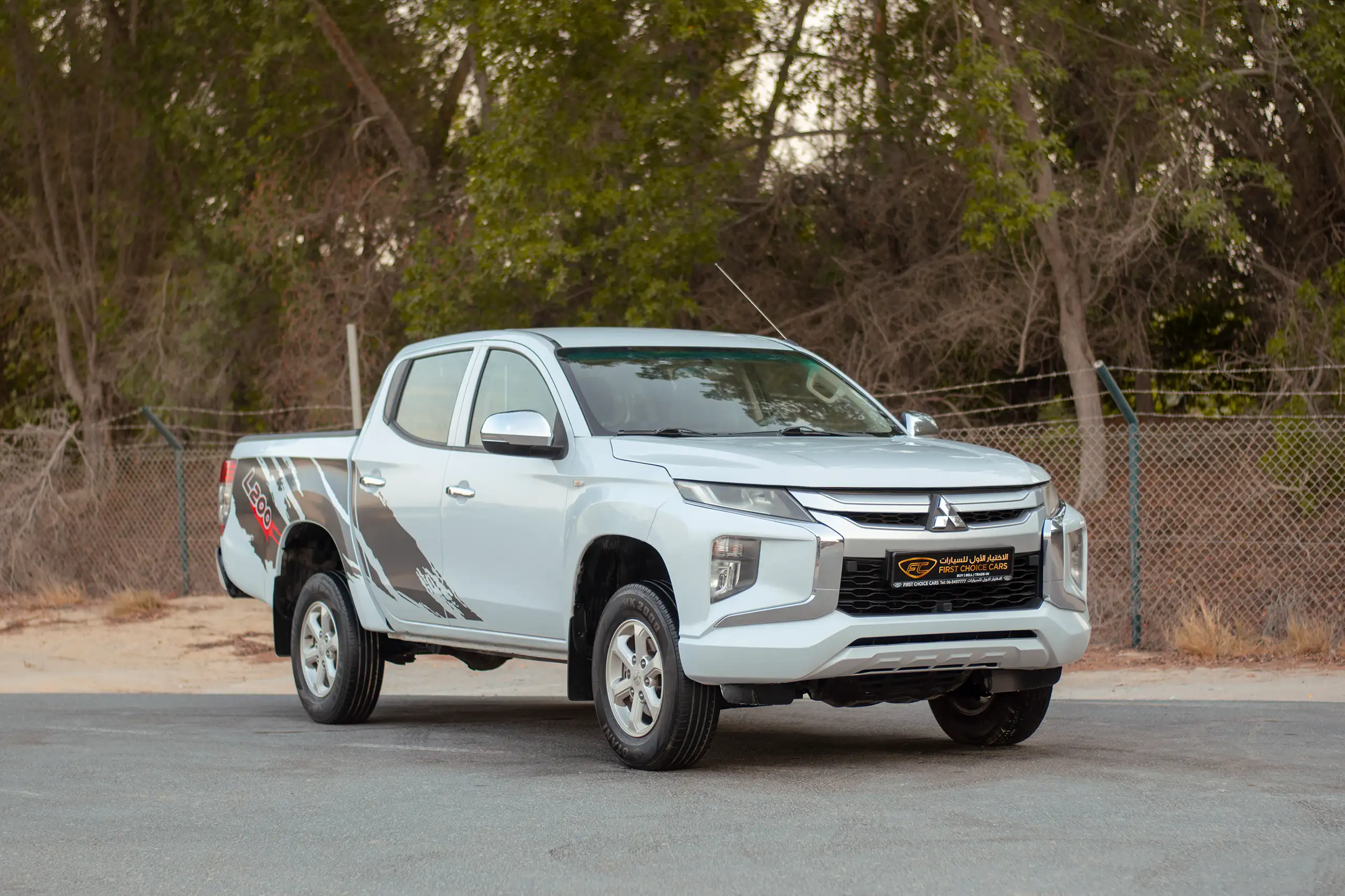Used 2020 Mitsubishi L200 Double Cab GLX White – Right Front Diagonal (45°) View at First Choice Cars Sharjah