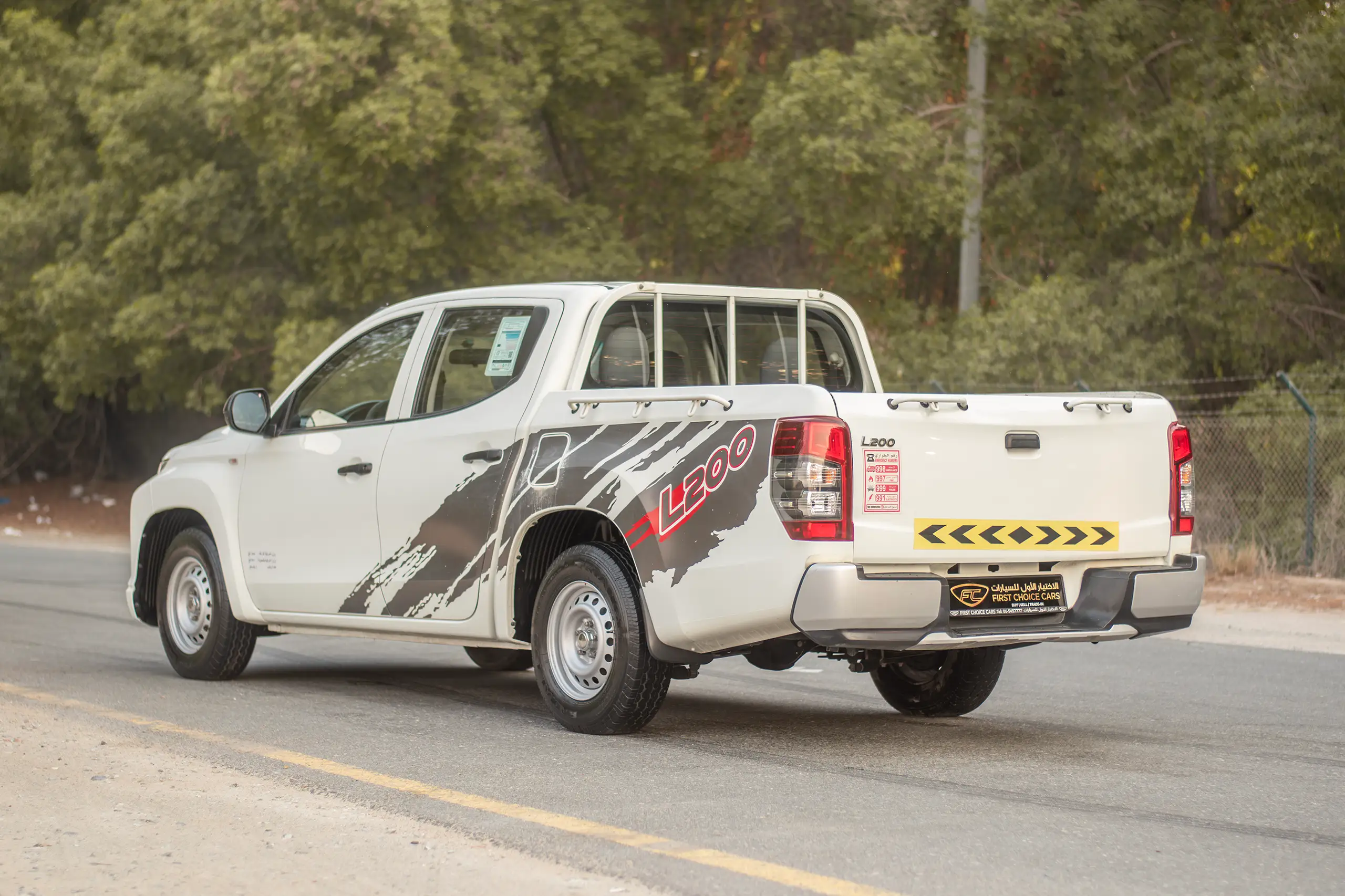 Used 2020 Mitsubishi L200 Double Cab GLX White – Left Back Diagonal (45°) View at First Choice Cars Sharjah