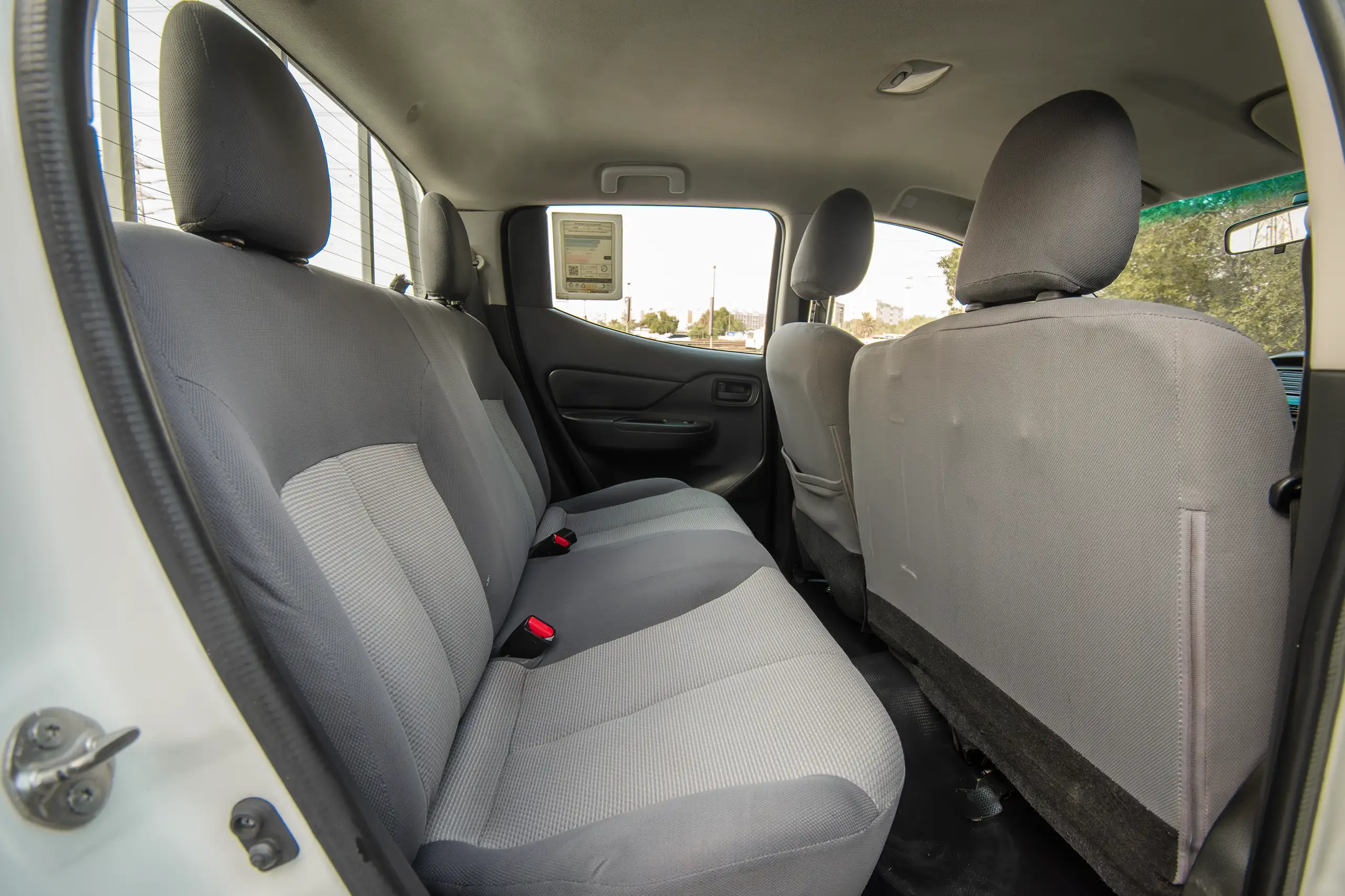 Used 2020 Mitsubishi L200 Double Cab GLX White – Rear Passenger Side Cabin View at First Choice Cars Sharjah