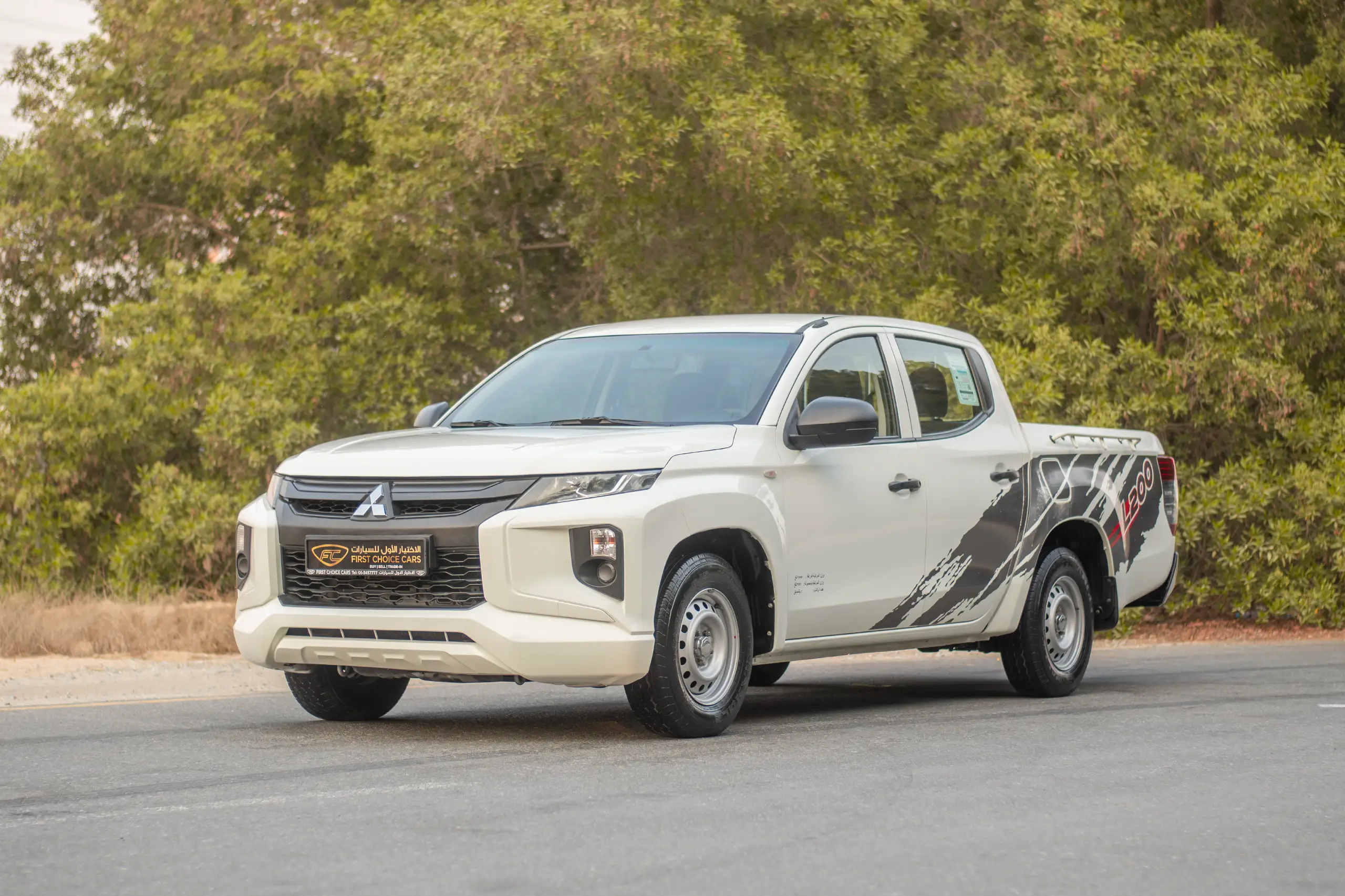 Used 2021 Mitsubishi L200 Double Cab GLX White – Left Front Diagonal (45°) View at First Choice Cars Sharjah