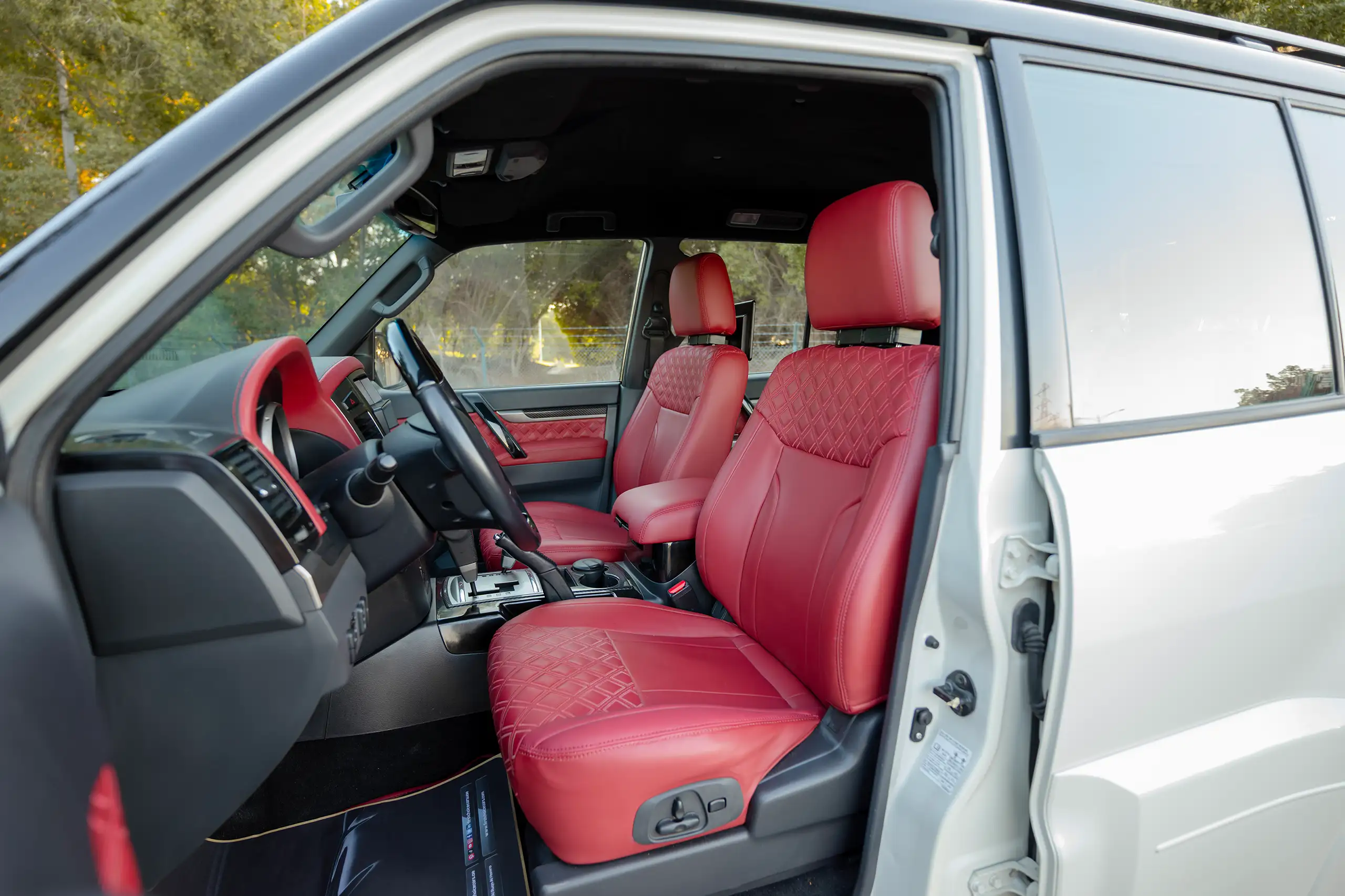 Used 2020 Mitsubishi Pajero Signature Edition White – Front Driver Side Cabin View at First Choice Cars Sharjah