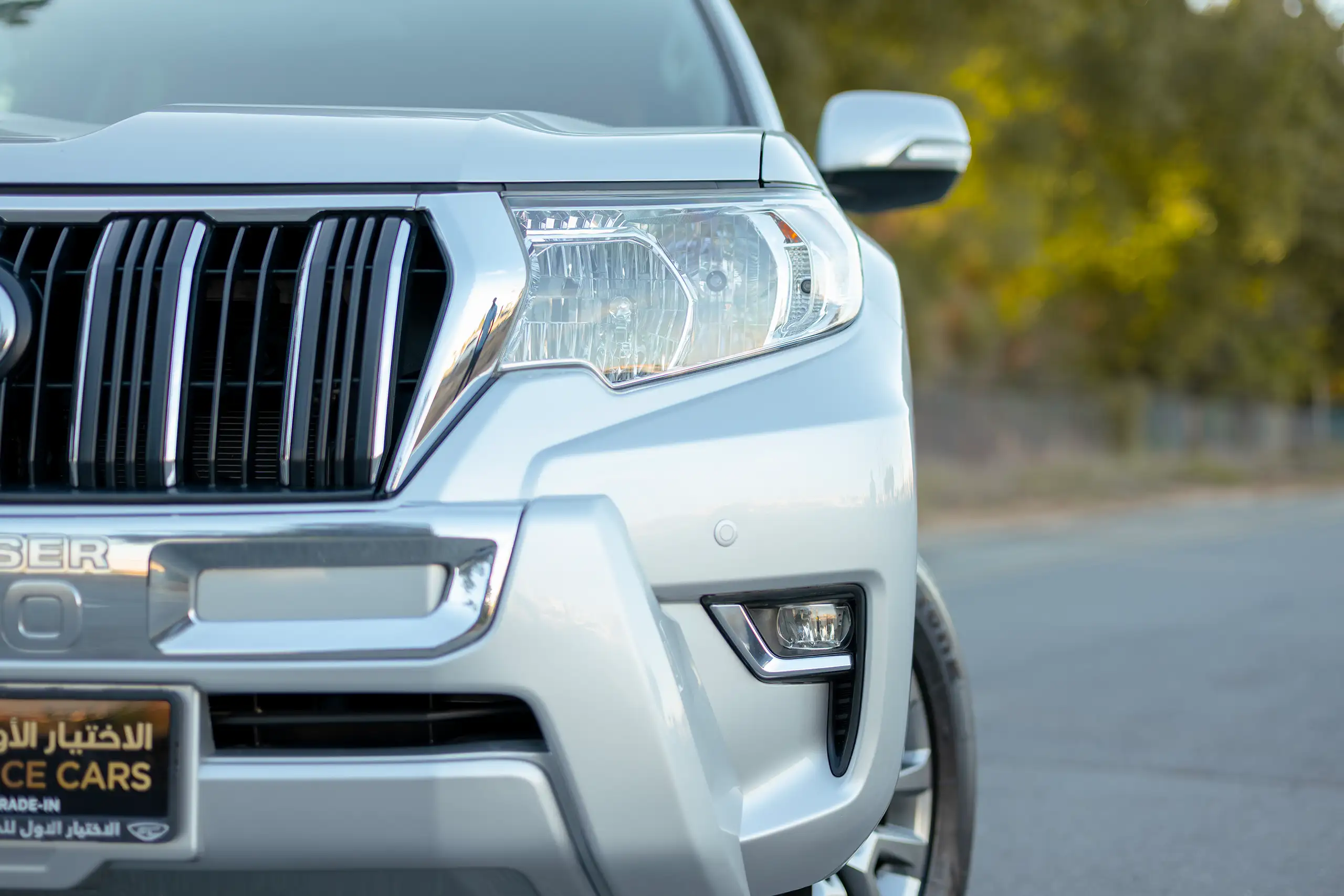 Used 2019 Toyota Prado VXR Silver – Headlight Close-up at First Choice Cars Sharjah