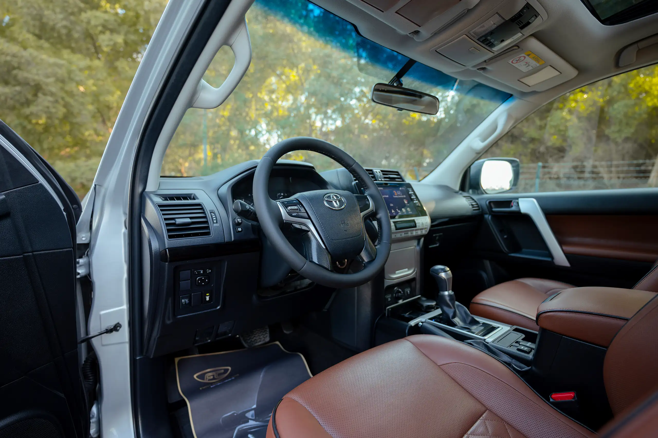 Used 2019 Toyota Prado VXR Silver – Driver Side Dashboard & Steering View at First Choice Cars Sharjah