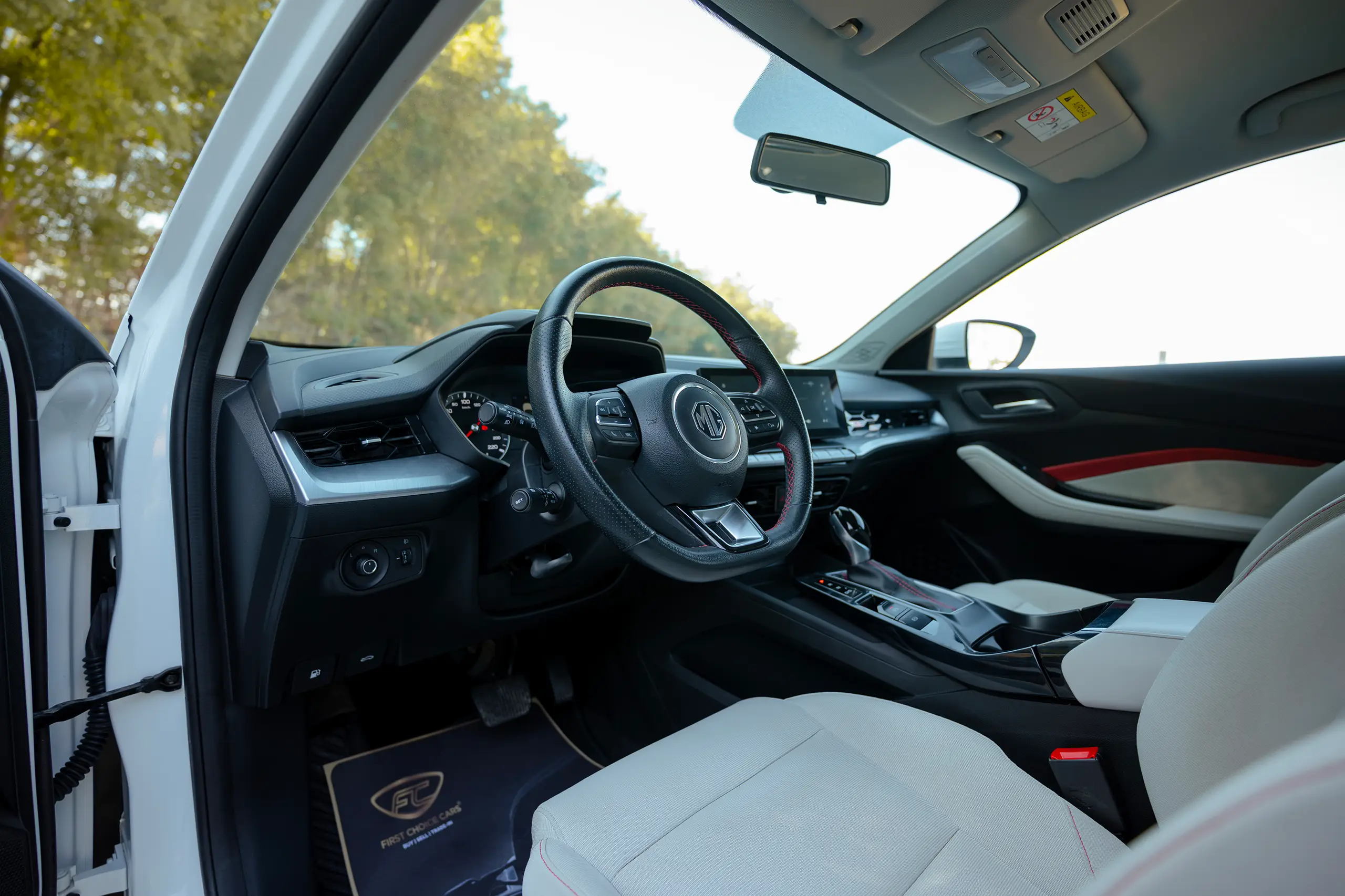 Used 2022 MG GT Comfort White – Driver Side Dashboard & Steering View at First Choice Cars Sharjah