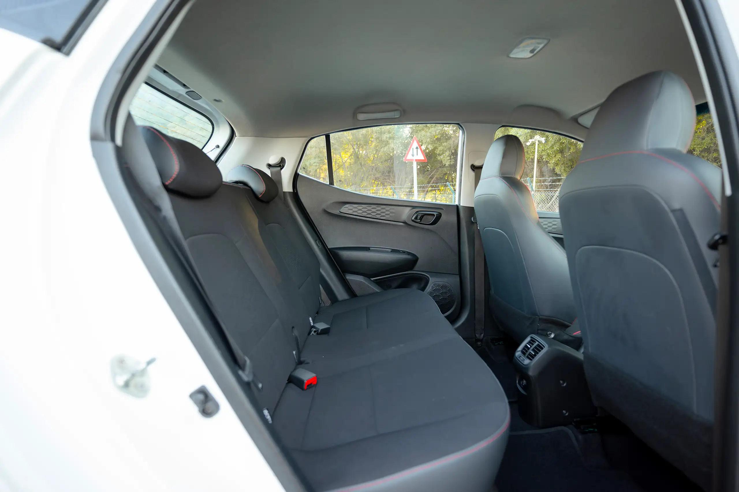 Used 2023 Hyundai Grand i10 Smart White – Rear Passenger Side Cabin View at First Choice Cars Sharjah