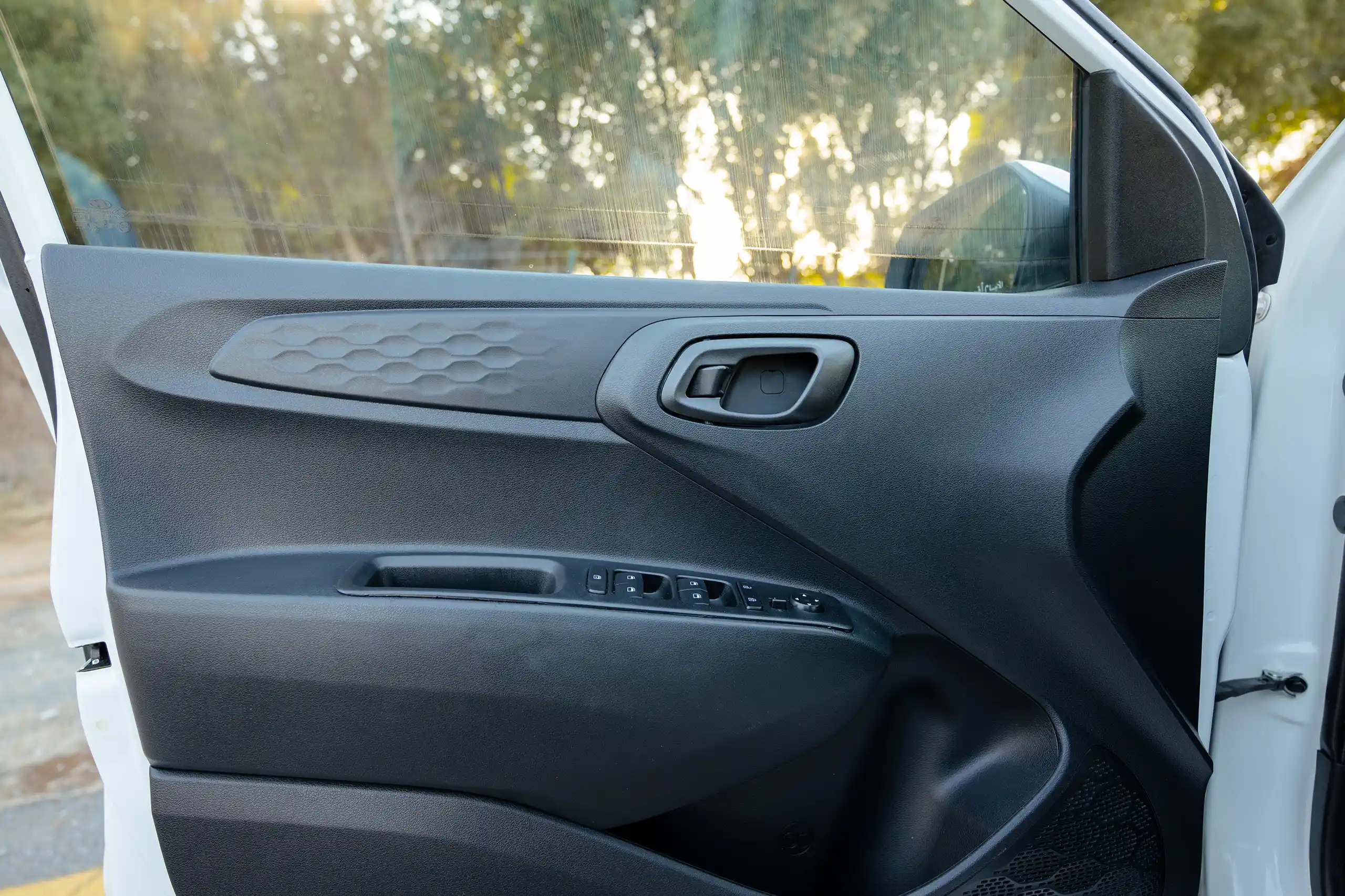 Used 2023 Hyundai Grand i10 Smart White – Driver Door Panel Full View at First Choice Cars Sharjah