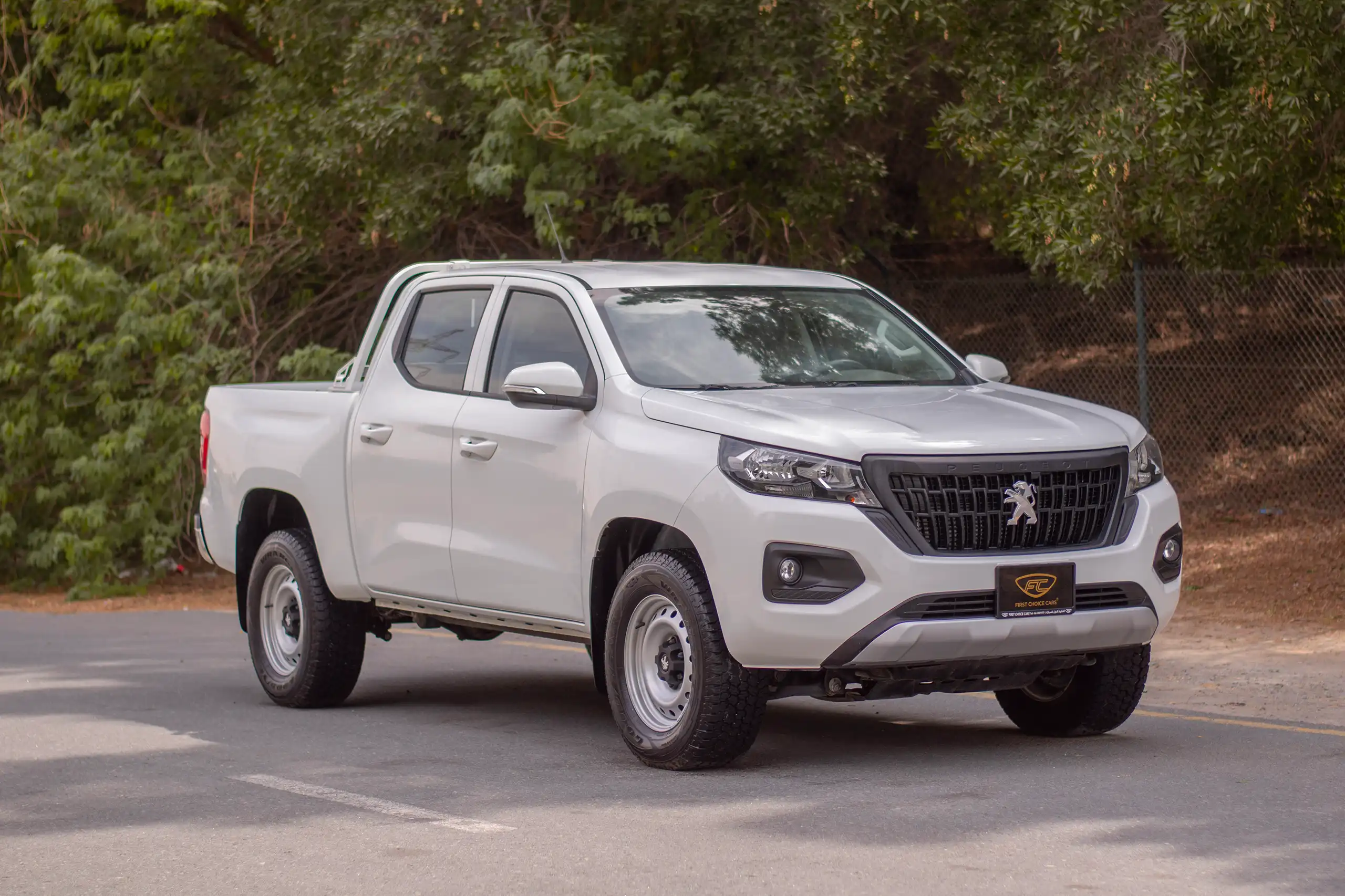 Used 2023 Peugeot Landtrek Double Cabin White – Right Front Diagonal (45°) View at First Choice Cars Sharjah