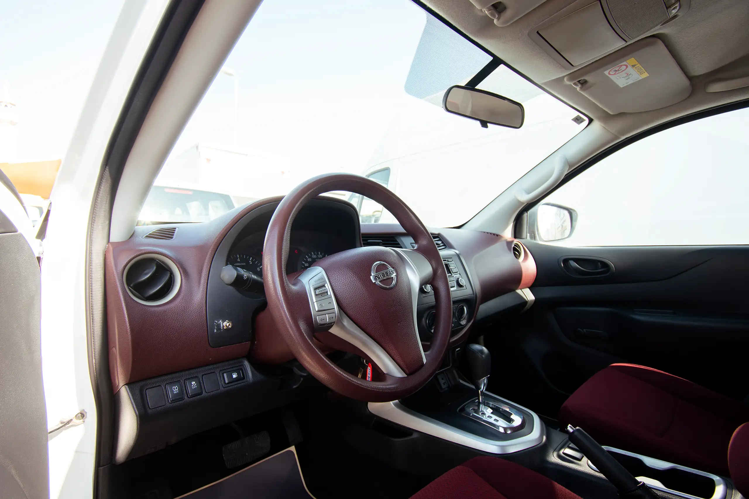 Used 2020 Nissan Navara SE White – Driver Side Dashboard & Steering View at First Choice Cars Sharjah
