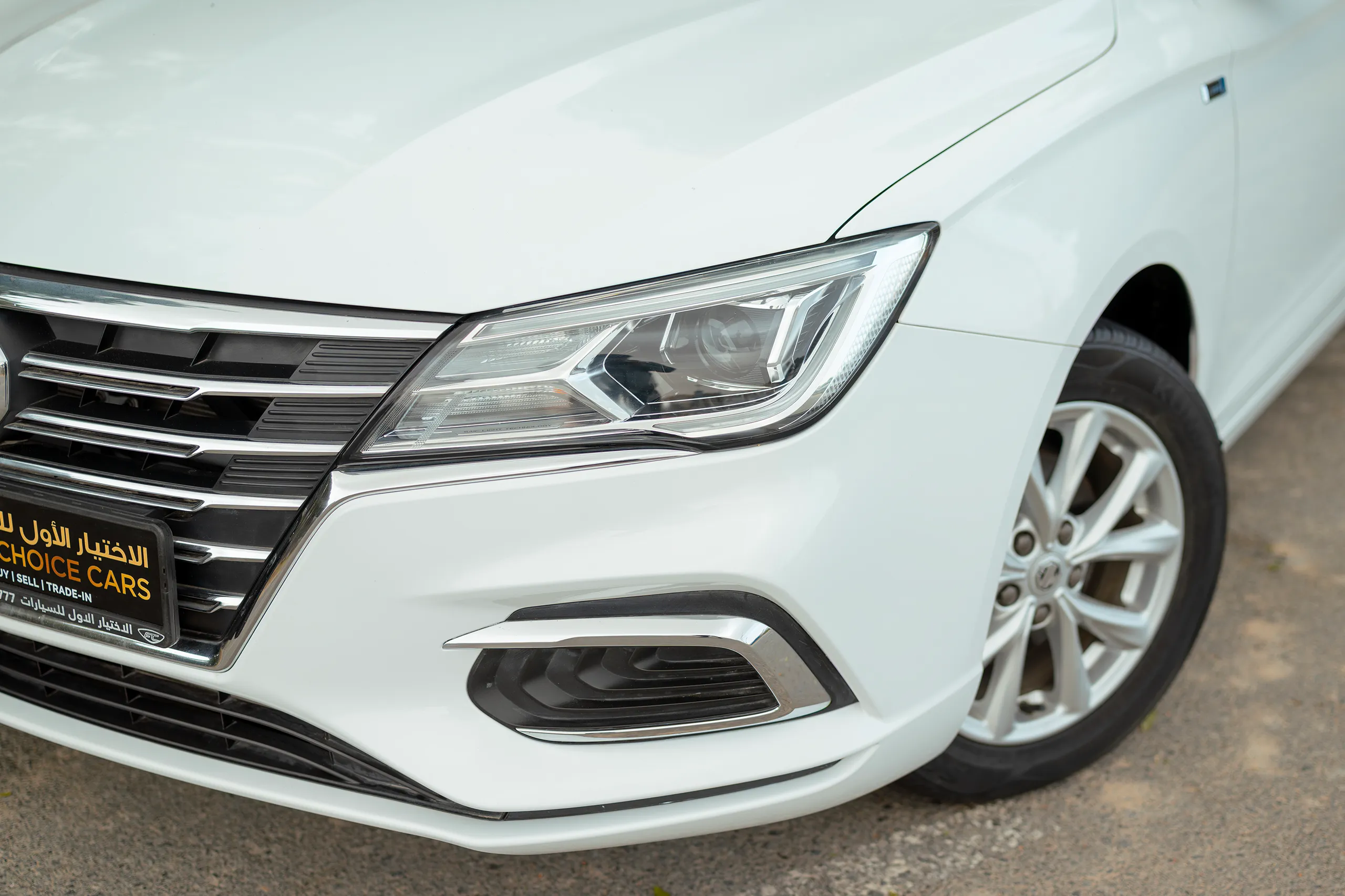 Used 2024 MG 5 Comfort White – Headlight Close-up at First Choice Cars Sharjah