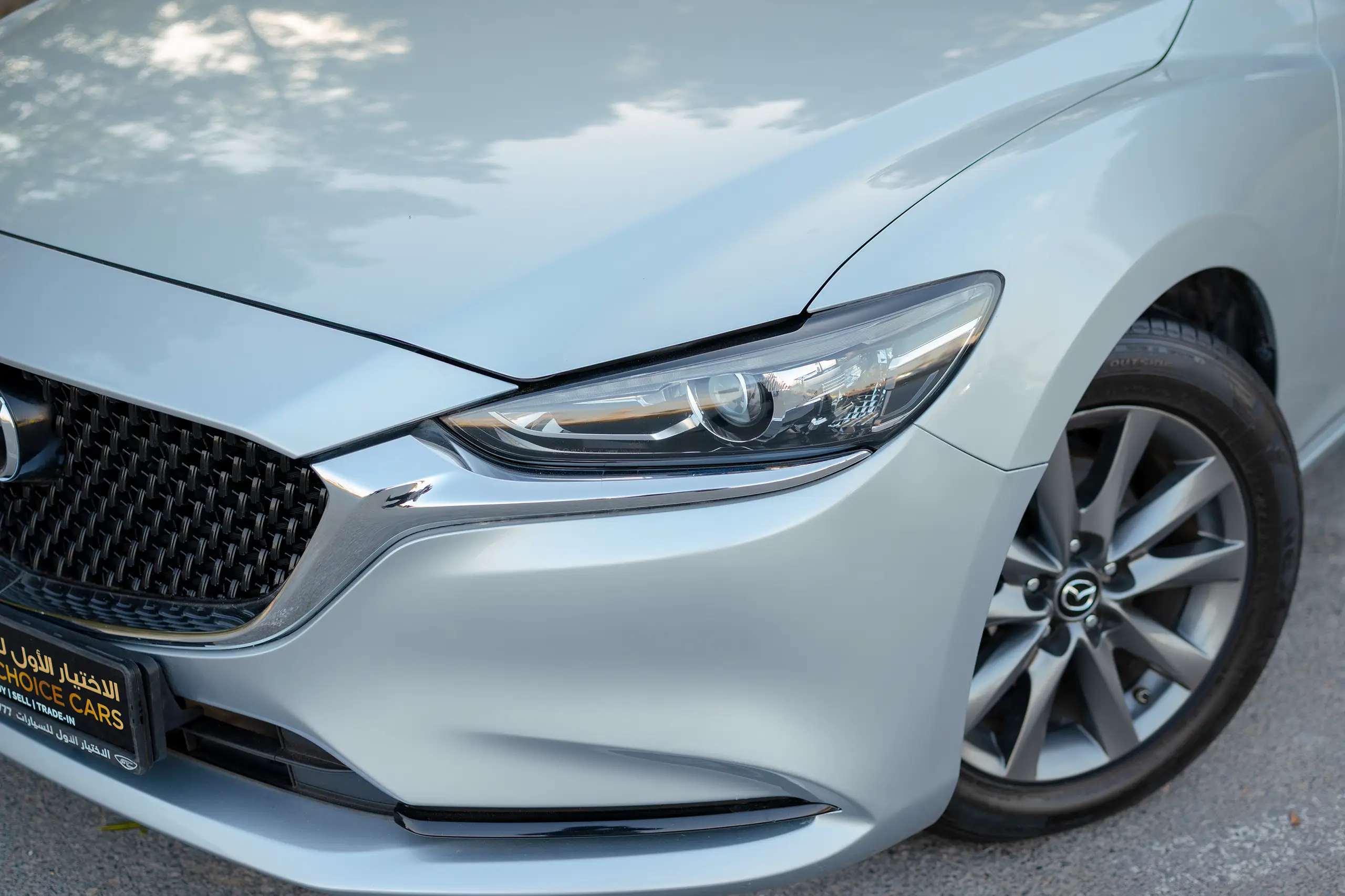 Used 2023 Mazda 6 S Grade Silver – Headlight Close-up at First Choice Cars Sharjah