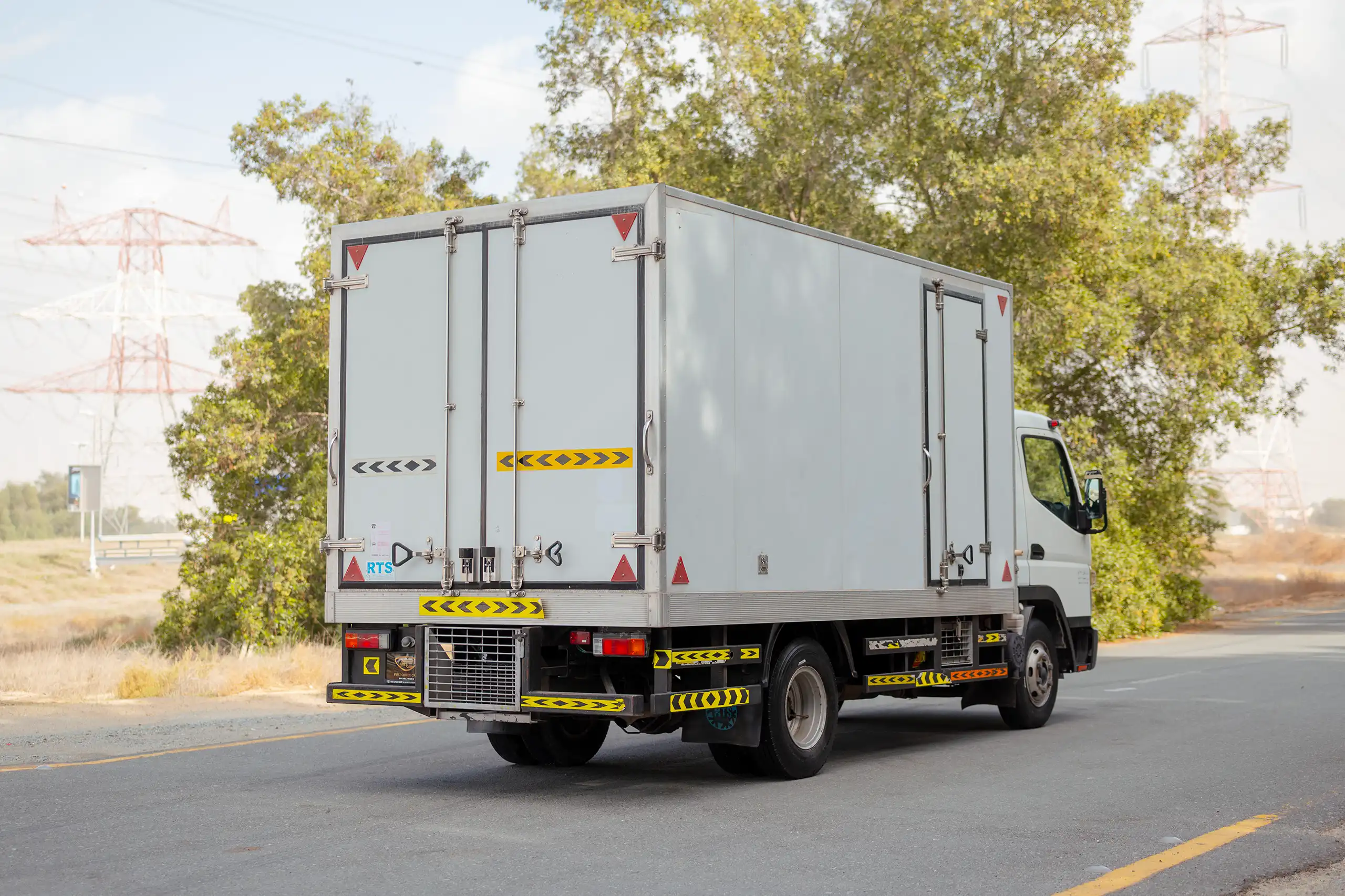 Used 2020 Mitsubishi Canter Chiller Box White – Right Back Diagonal (45°) View at First Choice Cars Sharjah