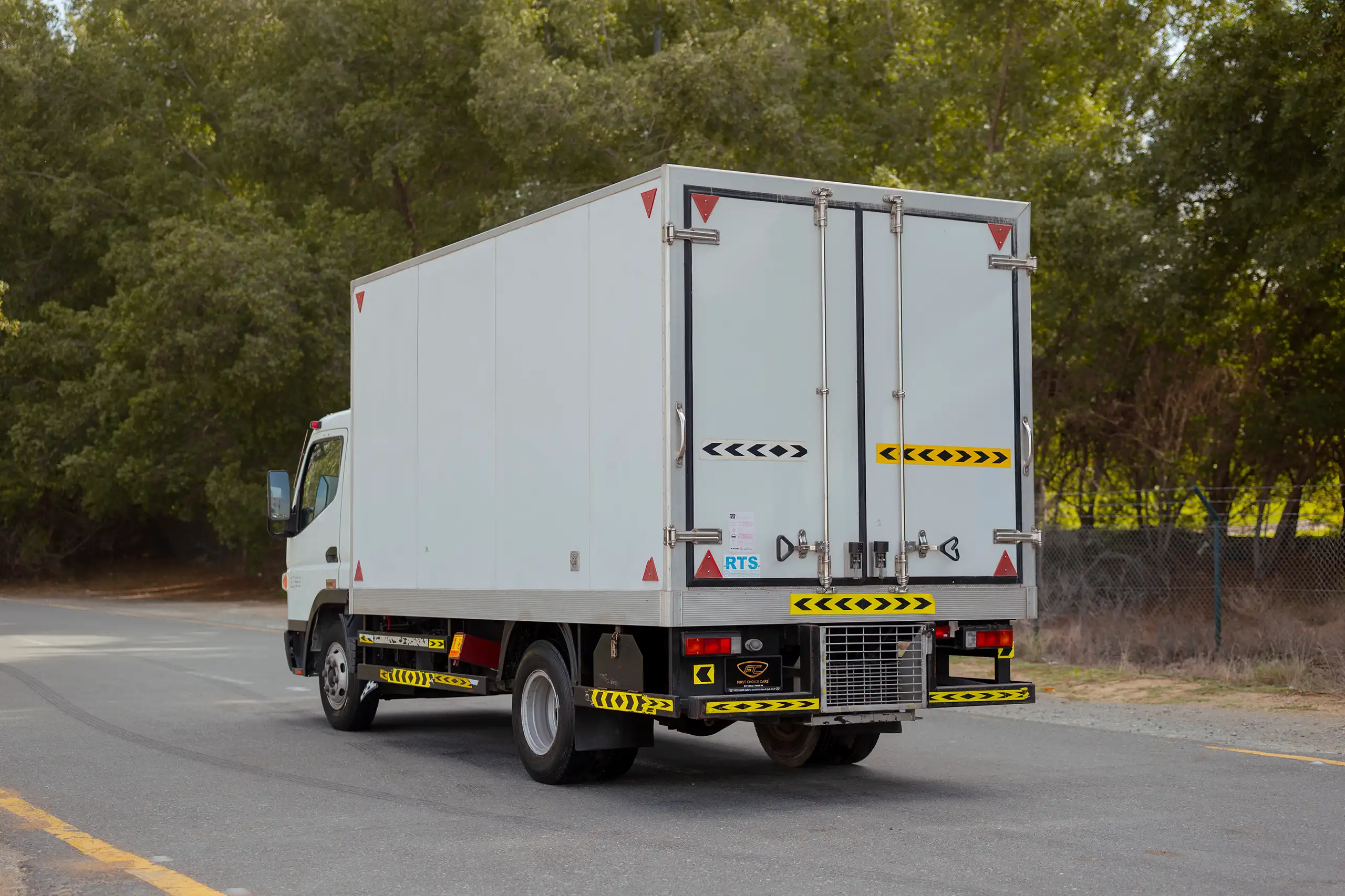 Used 2020 Mitsubishi Canter Chiller Box White – Left Back Diagonal (45°) View at First Choice Cars Sharjah