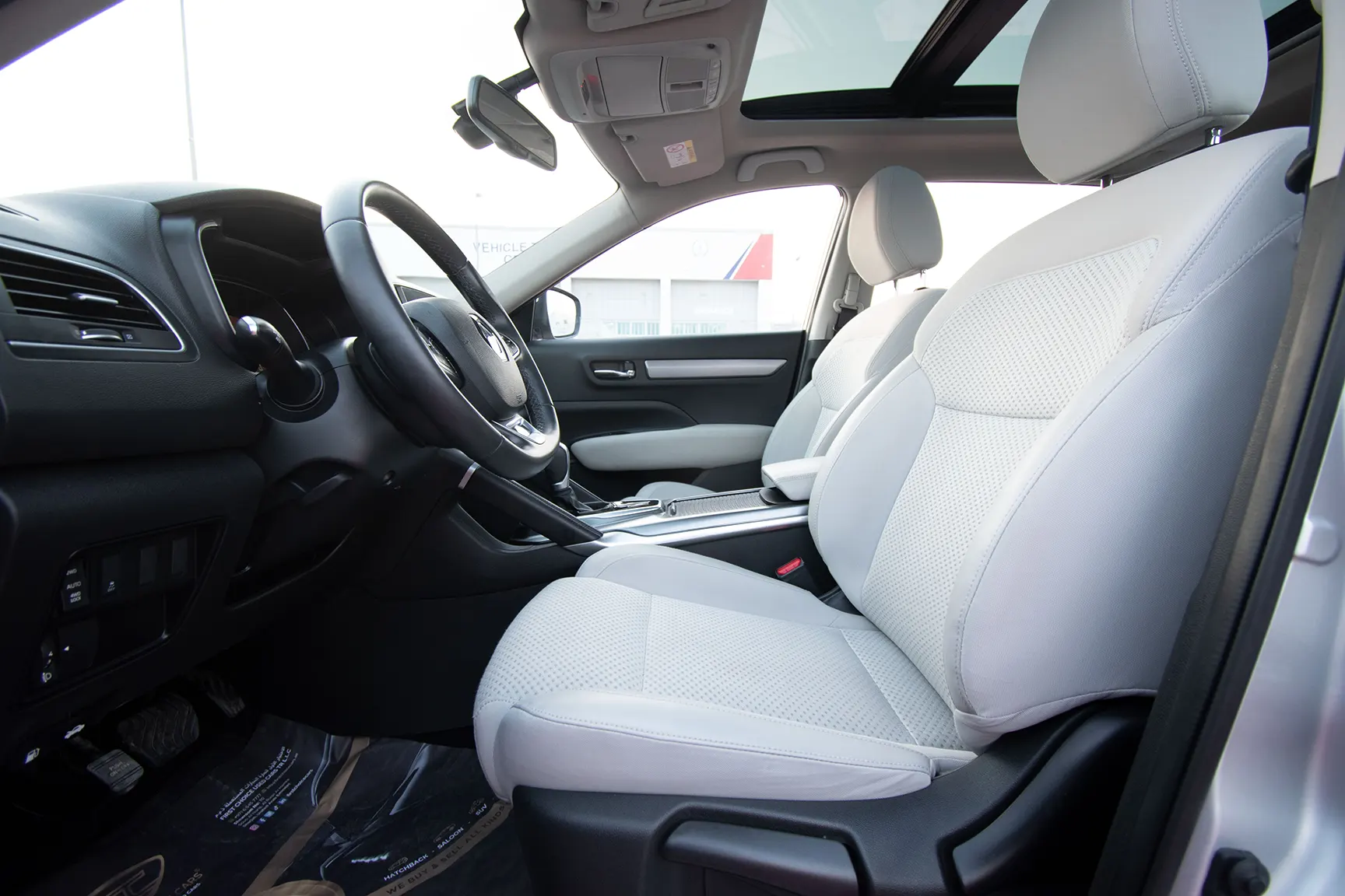 Used 2018 Renault Koleos Pe Silver – Front Driver Side Cabin View at First Choice Cars Sharjah