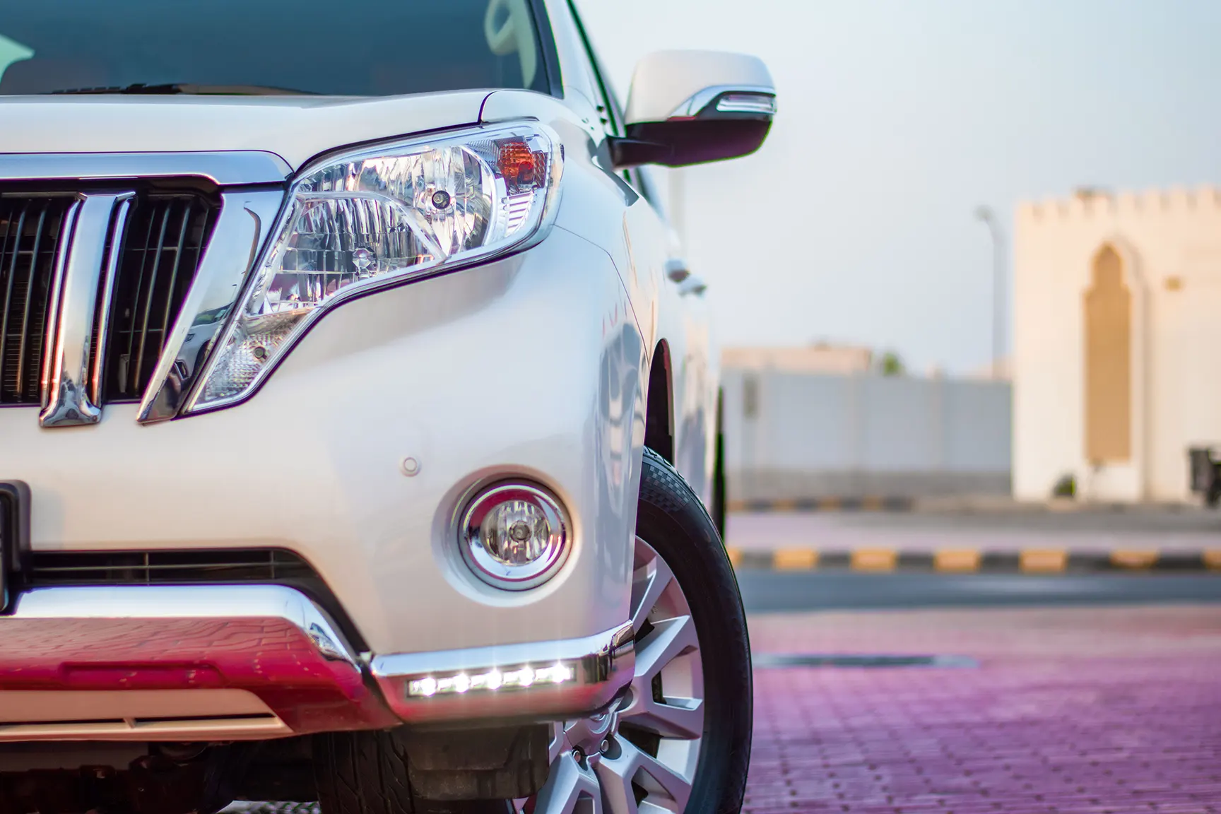 Used 2017 Toyota Prado VXR White – Headlight Close-up at First Choice Cars Sharjah