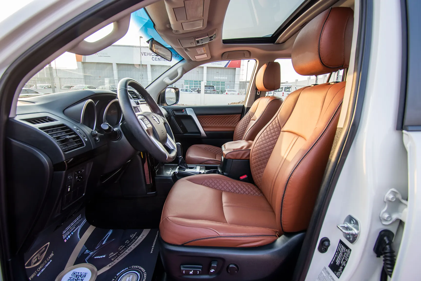 Used 2017 Toyota Prado VXR White – Front Driver Side Cabin View at First Choice Cars Sharjah